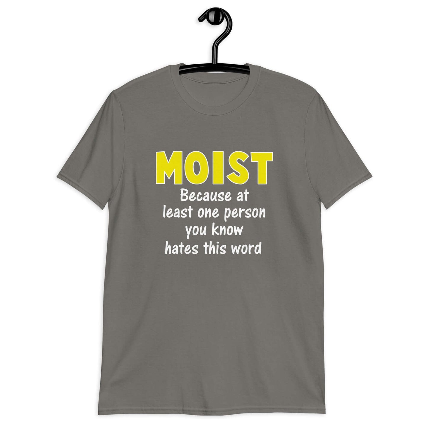 Charcoal grey t-shirt with the word Moist printed in large yellow bold font. In smaller font under the word moist is the phrase Because at least one person you know hates this word.