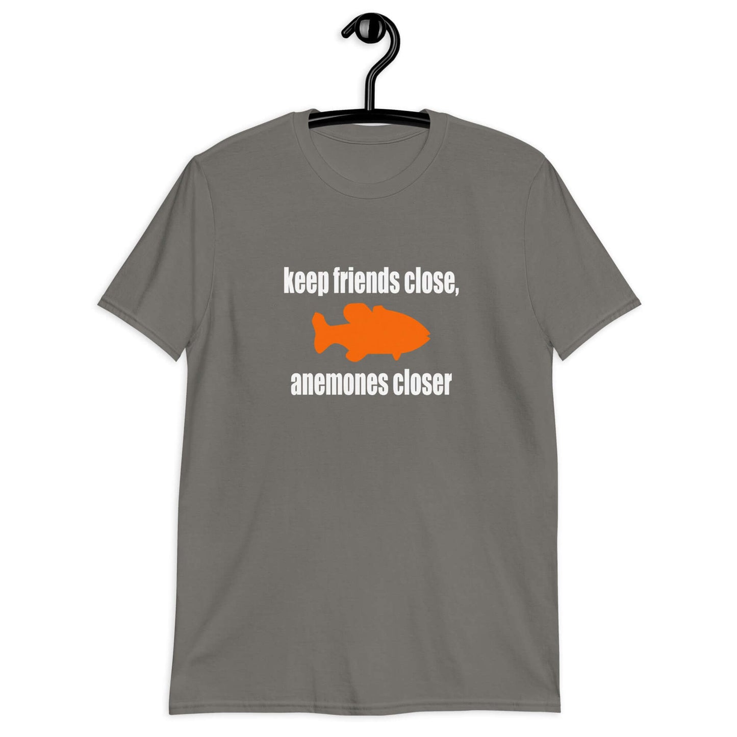 Charcoal grey t-shirt with the pun phrase Keep friends close, anemones closer with an image of an orange fish.