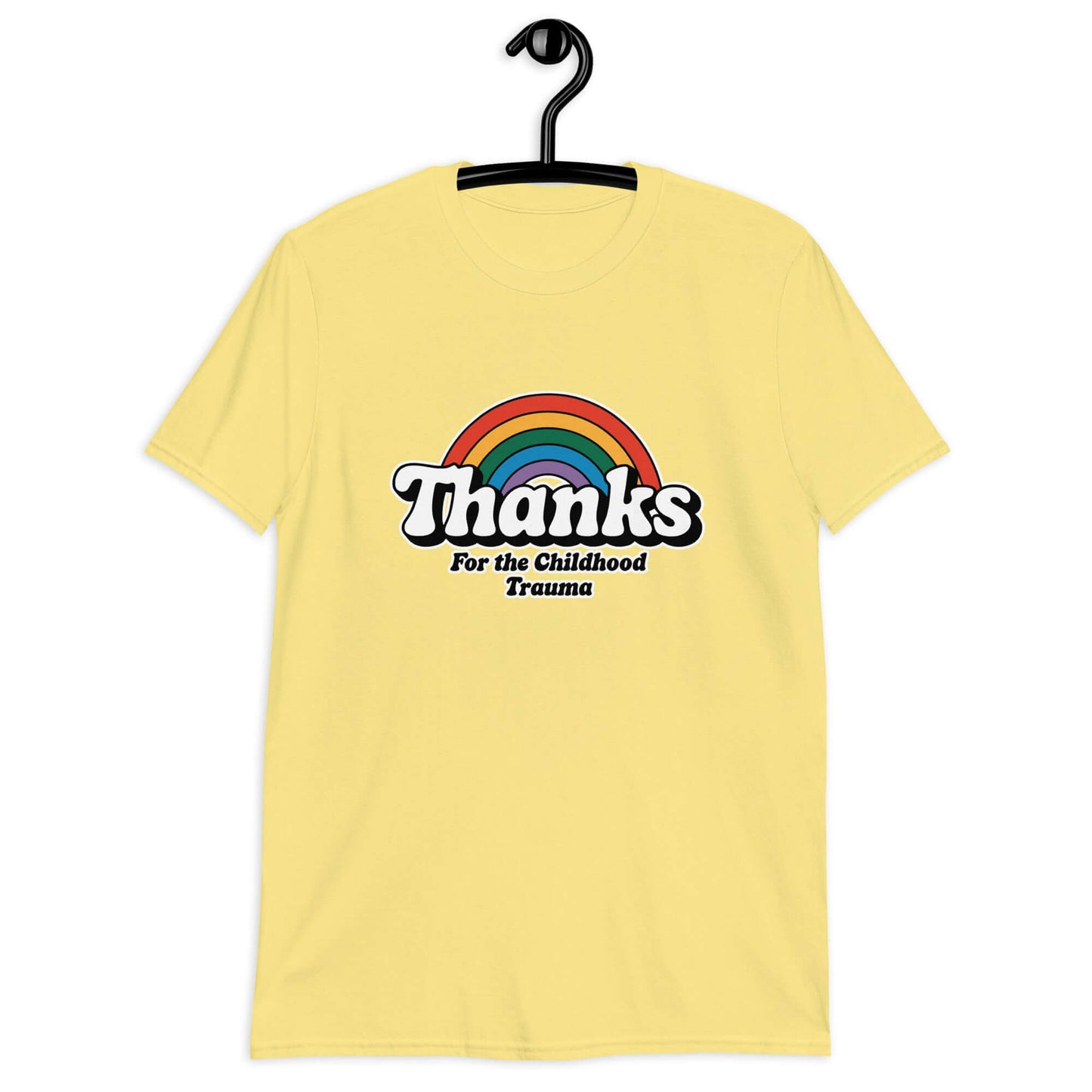 Cornsilk yellow t-shirt with an image of a rainbow and the words Thanks for the childhood trauma printed on the front. The word Thanks is large and the rest of the words are smaller under.