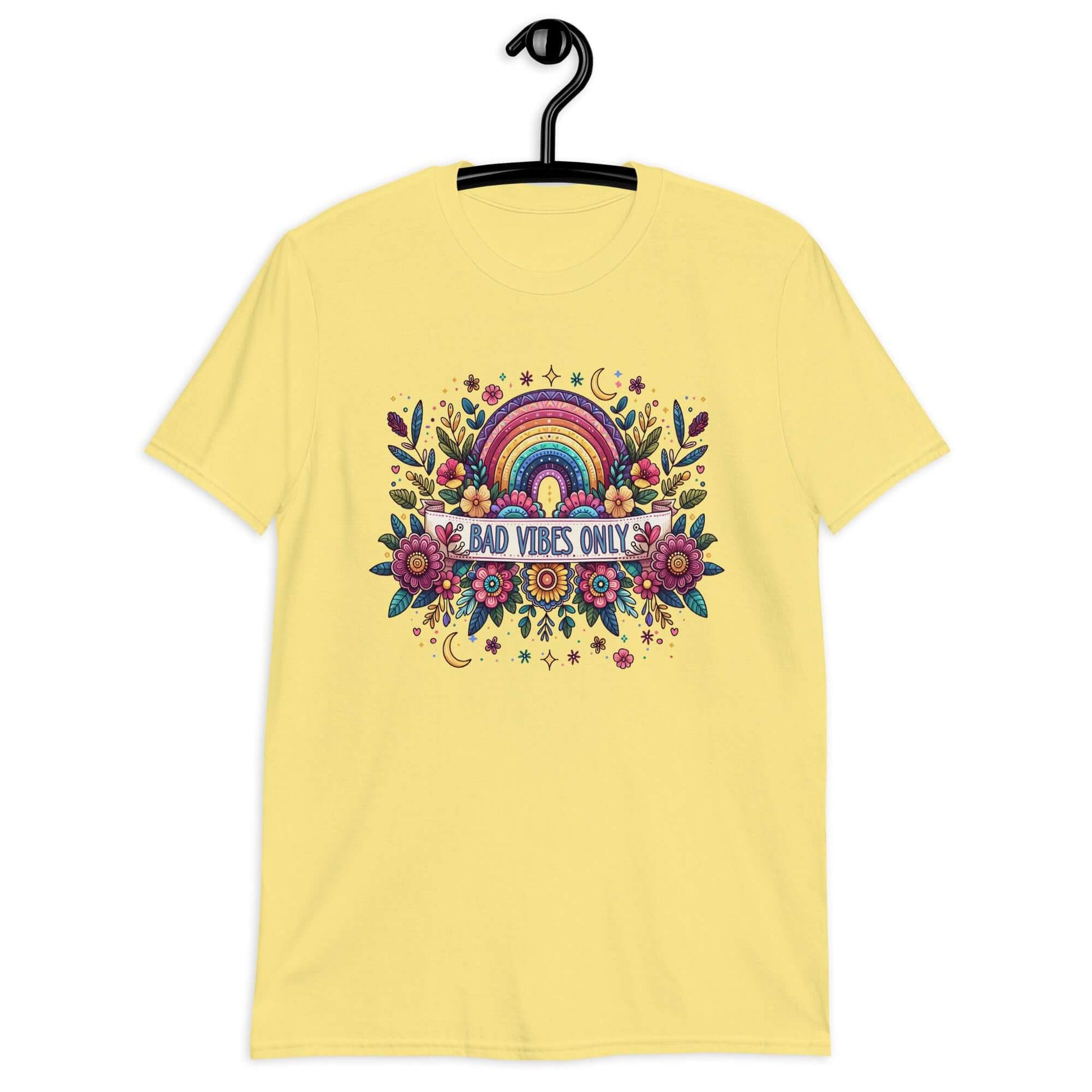 Cornsilk yellow t-shirt with a colorful boho rainbow floral design and the phrase Bad Vibes Only printed on the front.