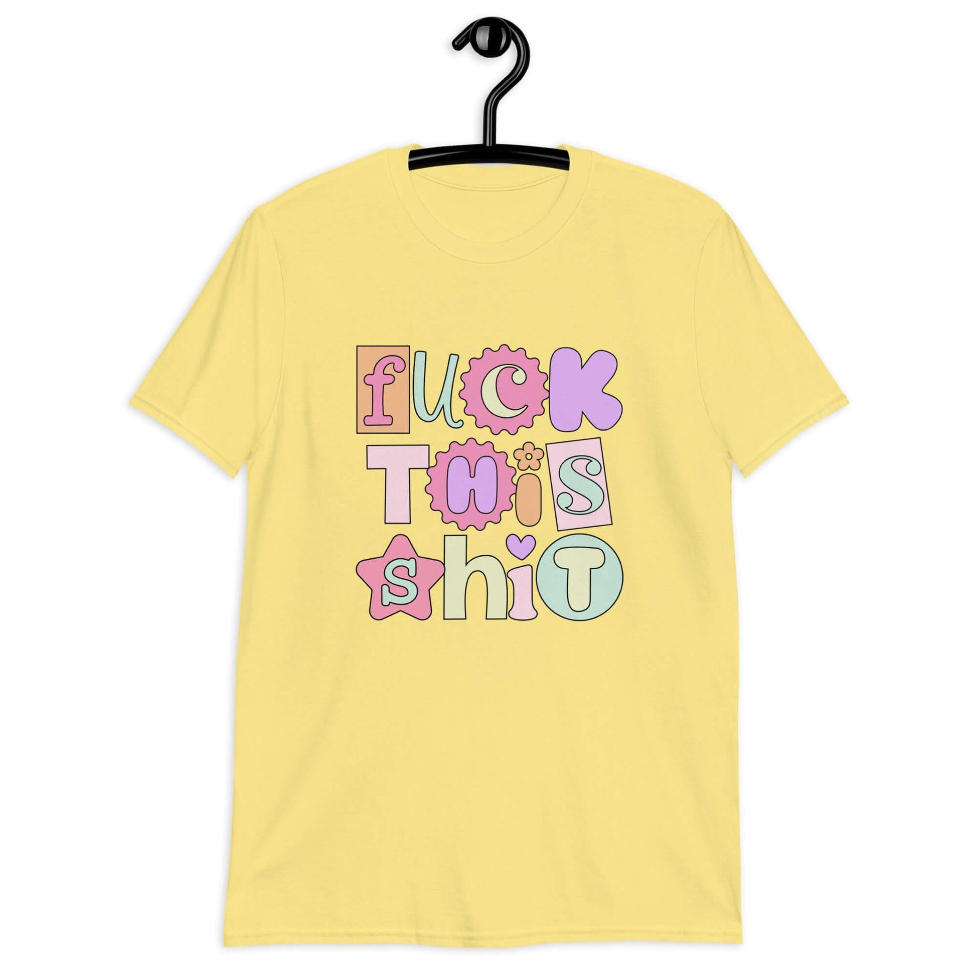 Cornsilk yellow t-shirt with colorful pastel font Fuck this shit graphics printed on the front.