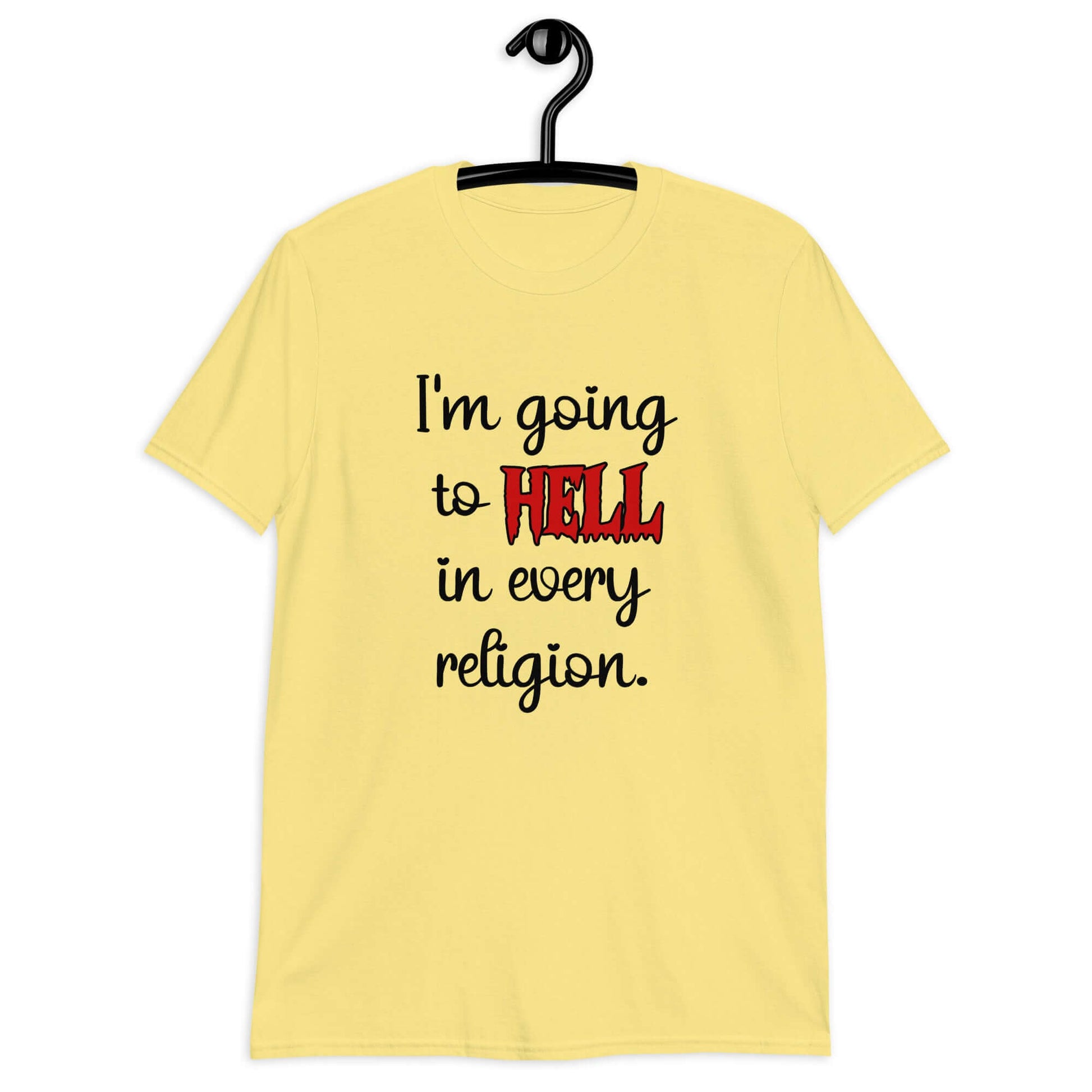 Cornsilk yellow t-shirt with the phrase I'm going to hell in every religion printed on the front. The word hell is printed in red. The rest of the text is black.