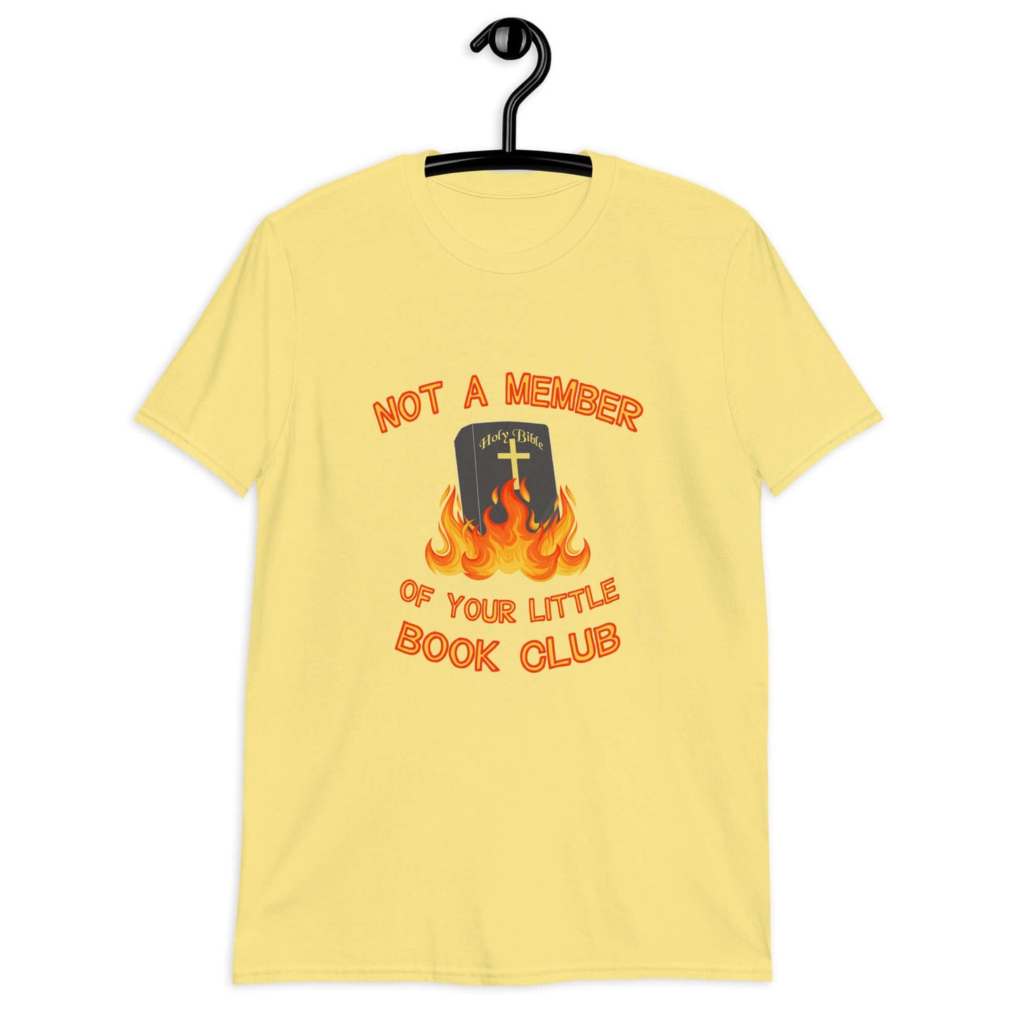 Cornsilk yellow t-shirt with image of a burning bible and the words Not a member of your little book club printed on the front.