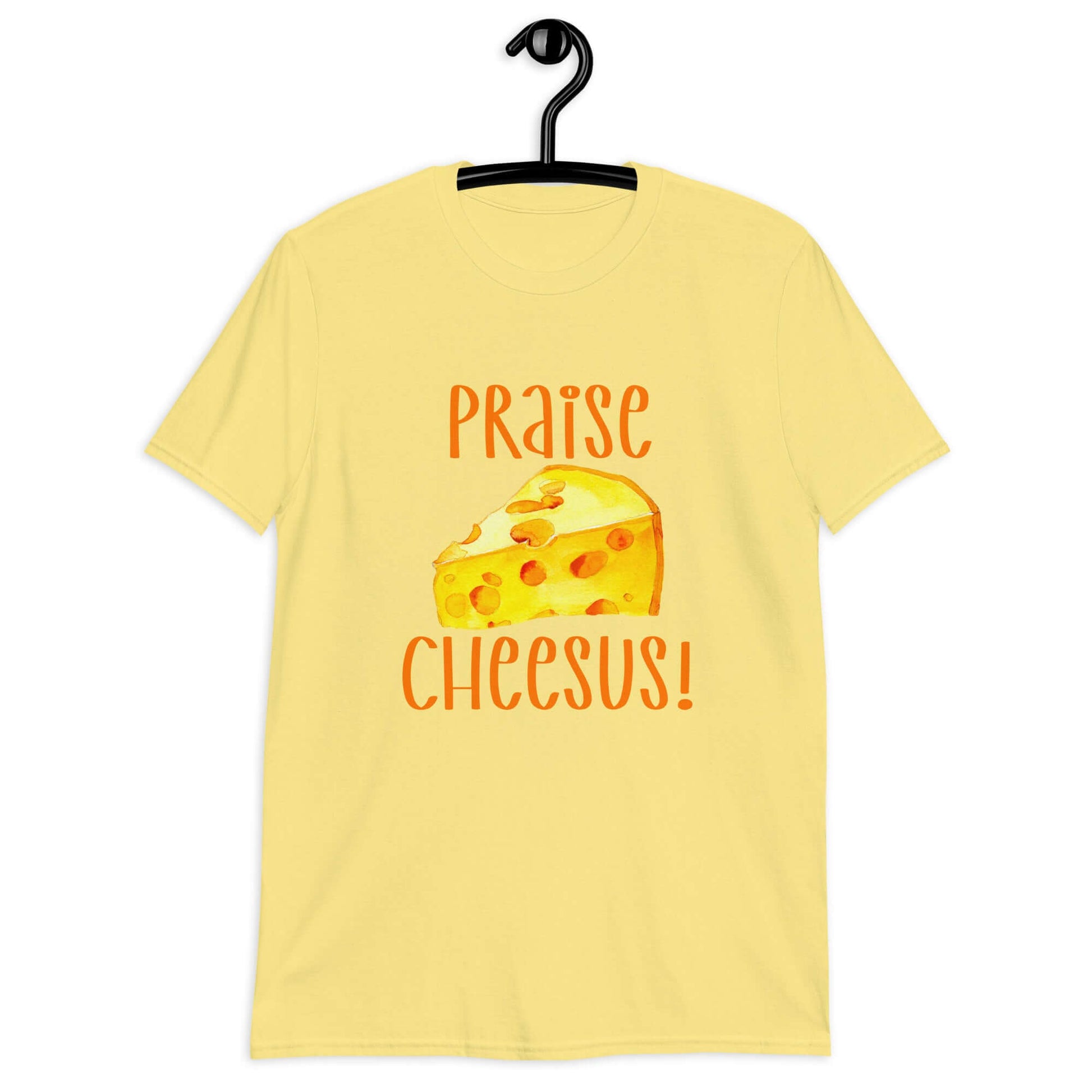 Cornsilk yellow t-shirt with funny graphics of a piece of swiss cheese and the words Praise Cheesus printed on the front of the hoodie in yellow and orange.