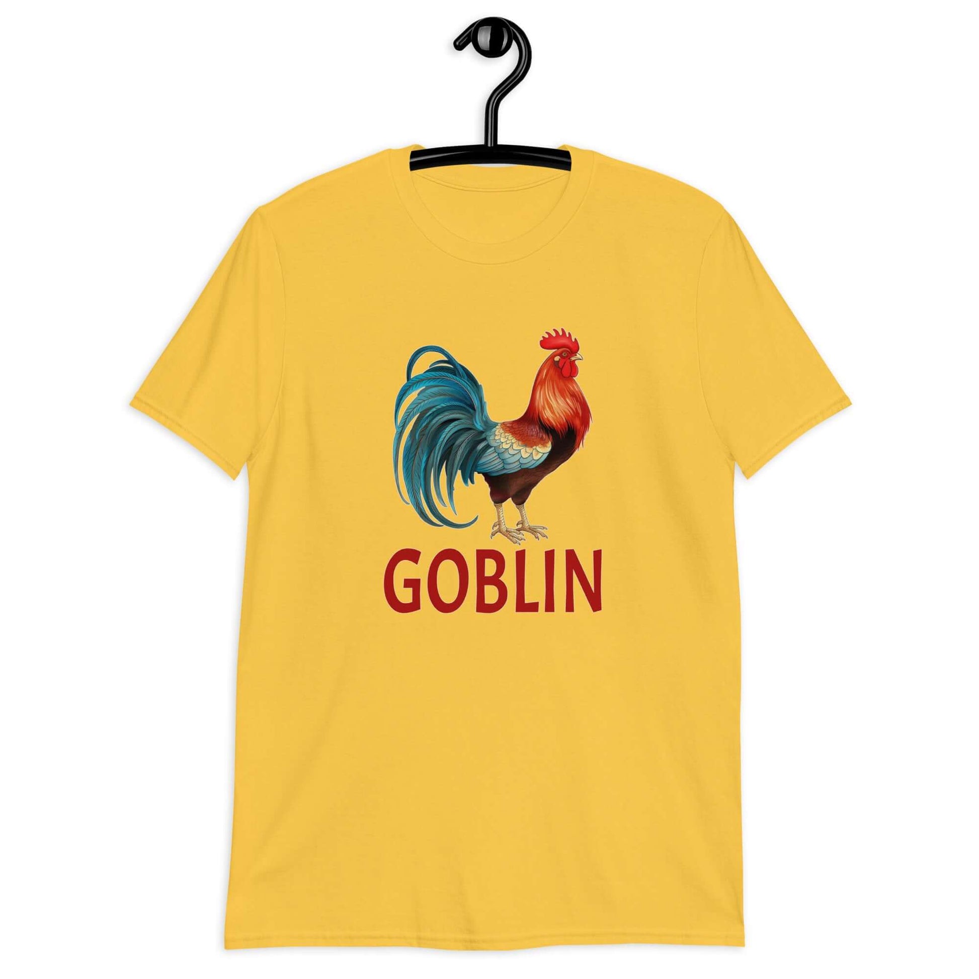 Daisy yellow t-shirt with an image of a rooster and the word Goblin printed under the rooster. The graphics are printed on the front of the shirt.
