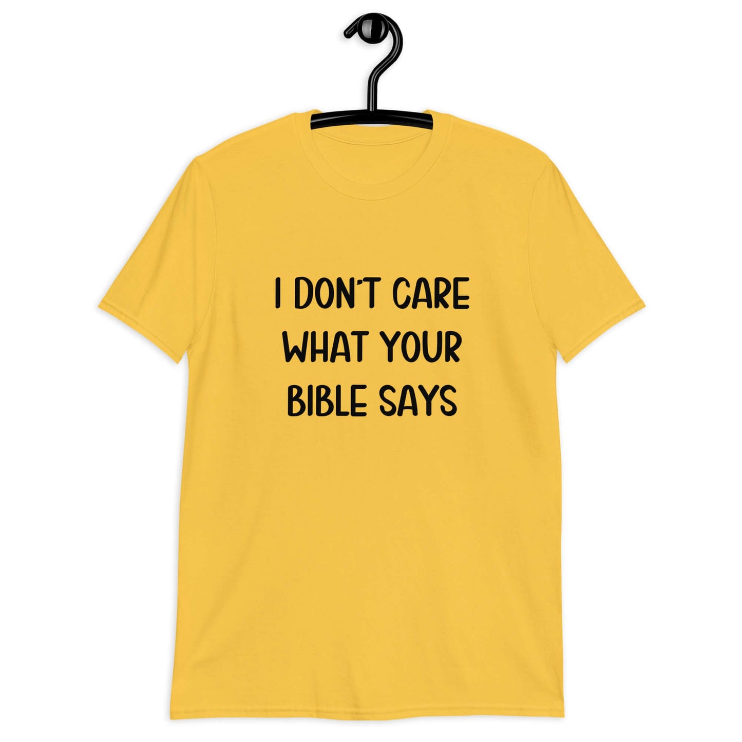 Daisy yellow t-shirt with the phrase I don't care what your bible says printed on the front.