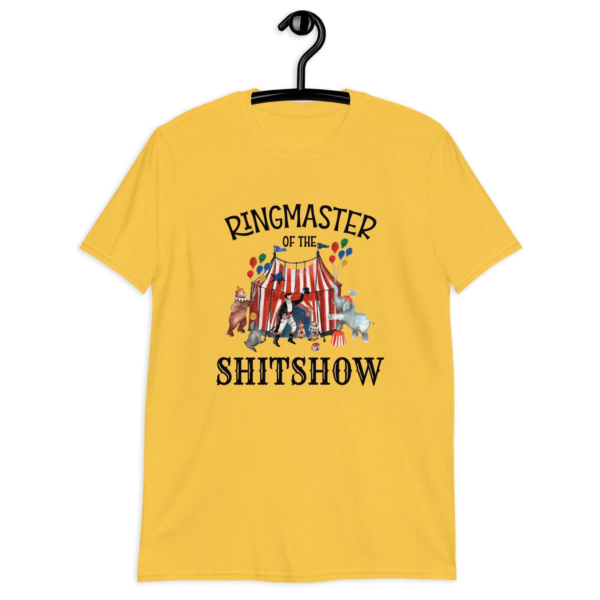 Daisy yellow t-shirt with a circus theme graphic and the words Ringmaster of the Shitshow printed on the front.