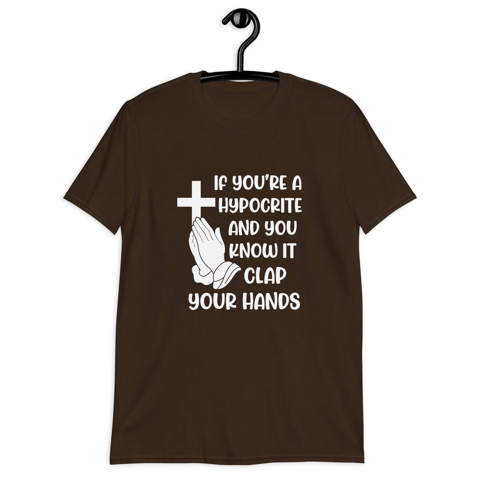 Dark brown t-shirt with image of a cross and praying hands & the words If you're a hypocrite and you know it clap your hands printed on the front.