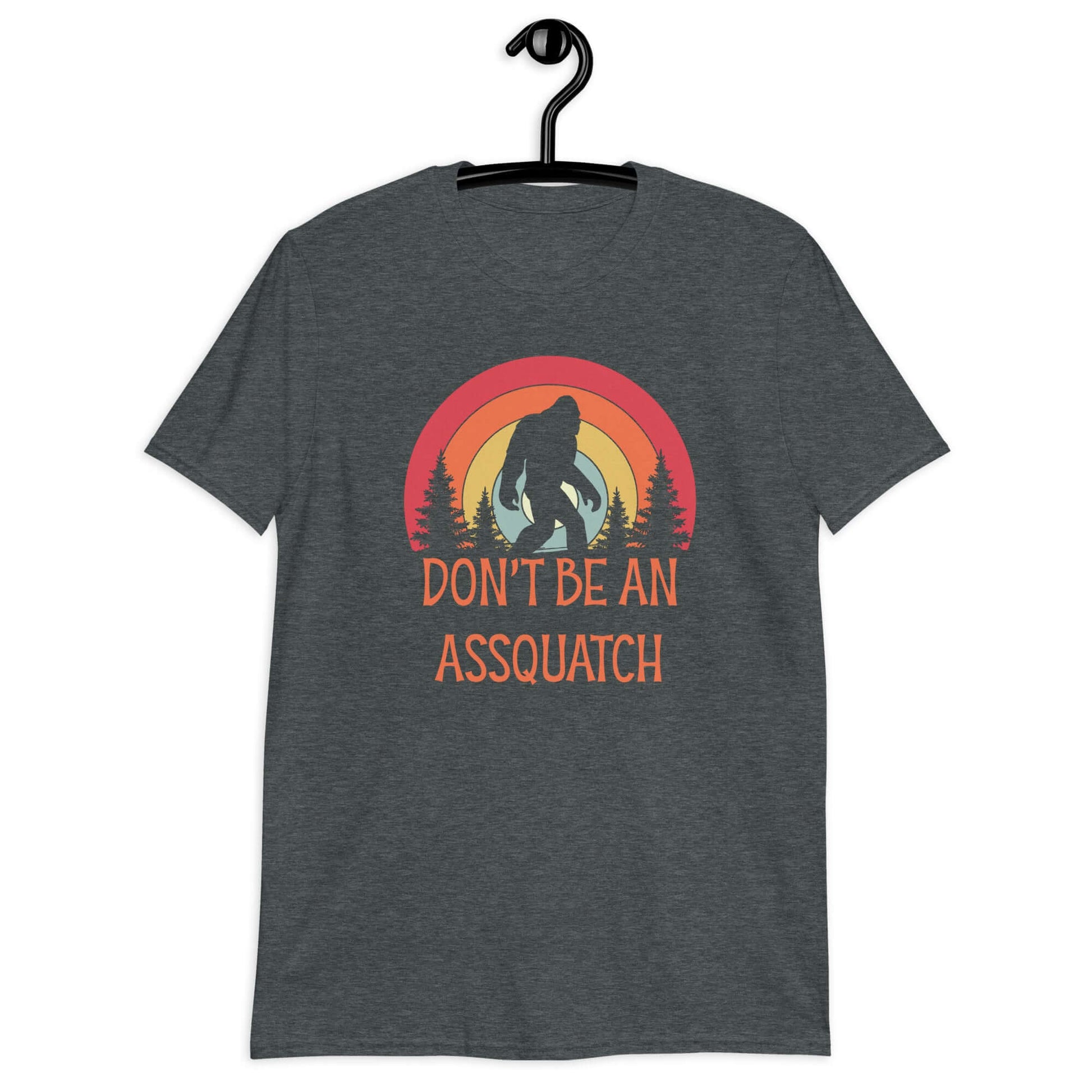 Dark heather t-shirt with sasquatch graphic with sasquatch graphic and the words don't be an assquatch printed on the front.