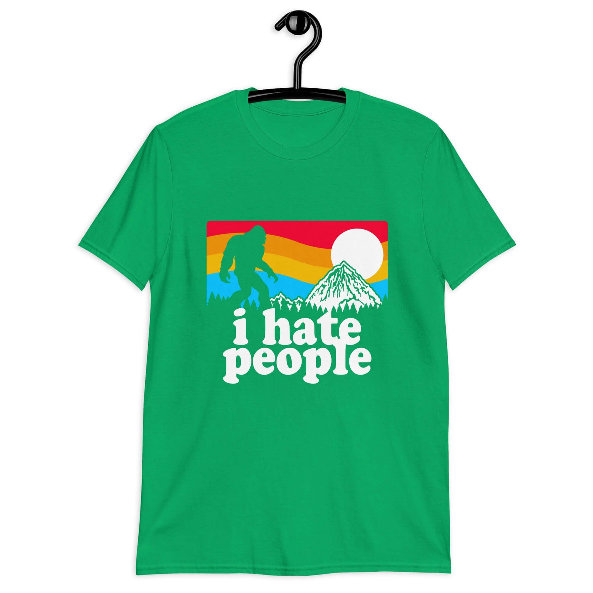 Irish green t-shirt with a graphic of Bigfoot walking into the sunset with the words I hate people printed on the front.