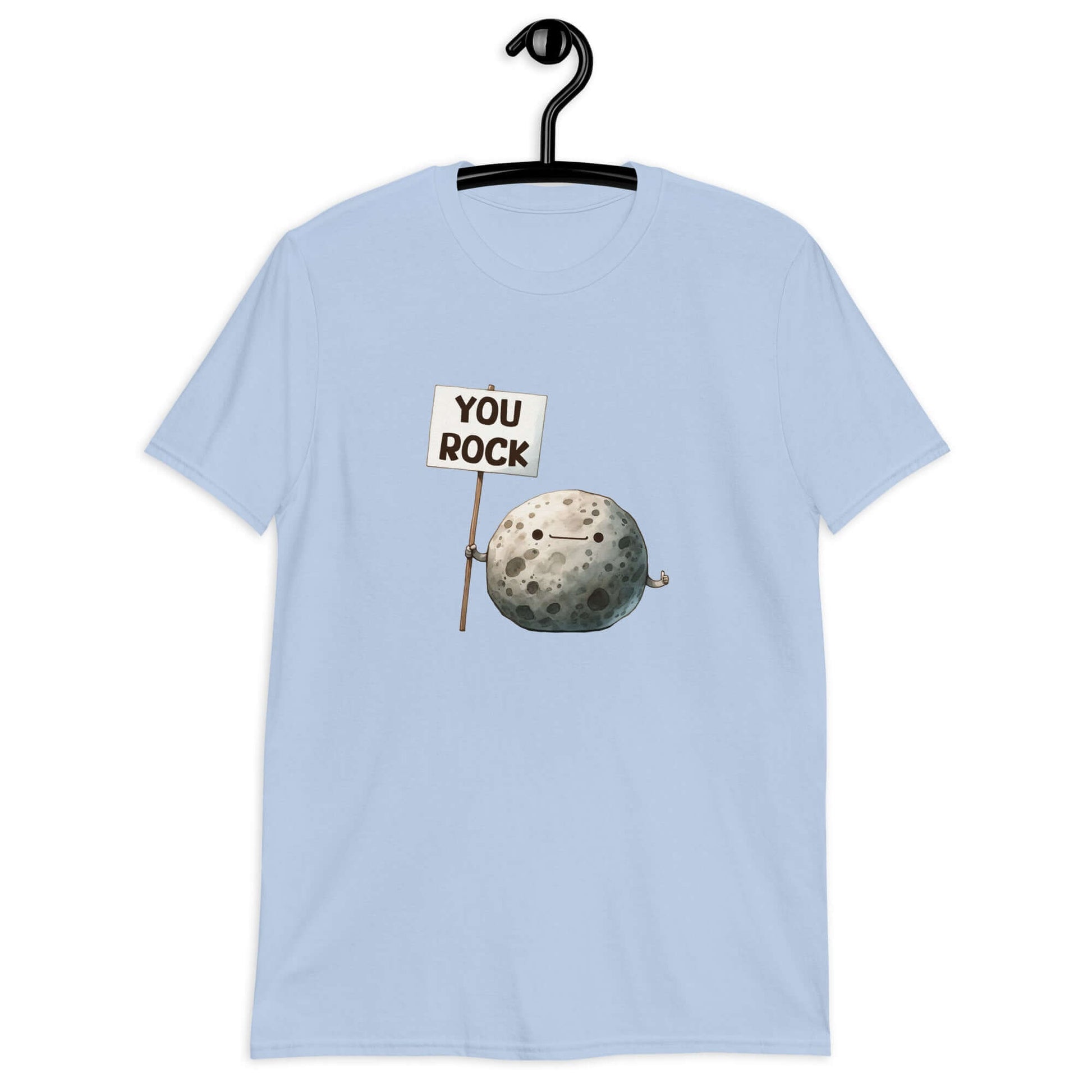 Light blue t-shirt that has an image of a grey rock that is holding a sign. The sign says You Rock. The image is printed on the front of the t-shirt..