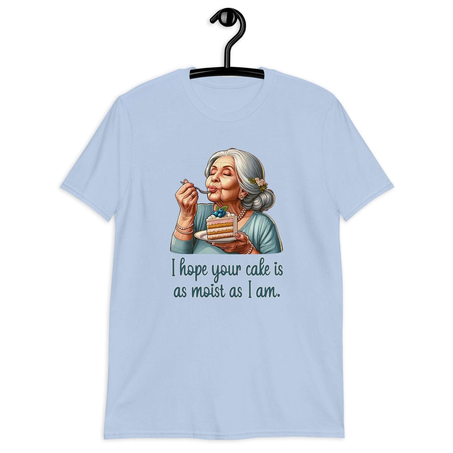 Light blue t-shirt with image of grey haired older woman enjoying a bite of a piece of cake with the words I hope your cake is as moist as I am printed on the front.