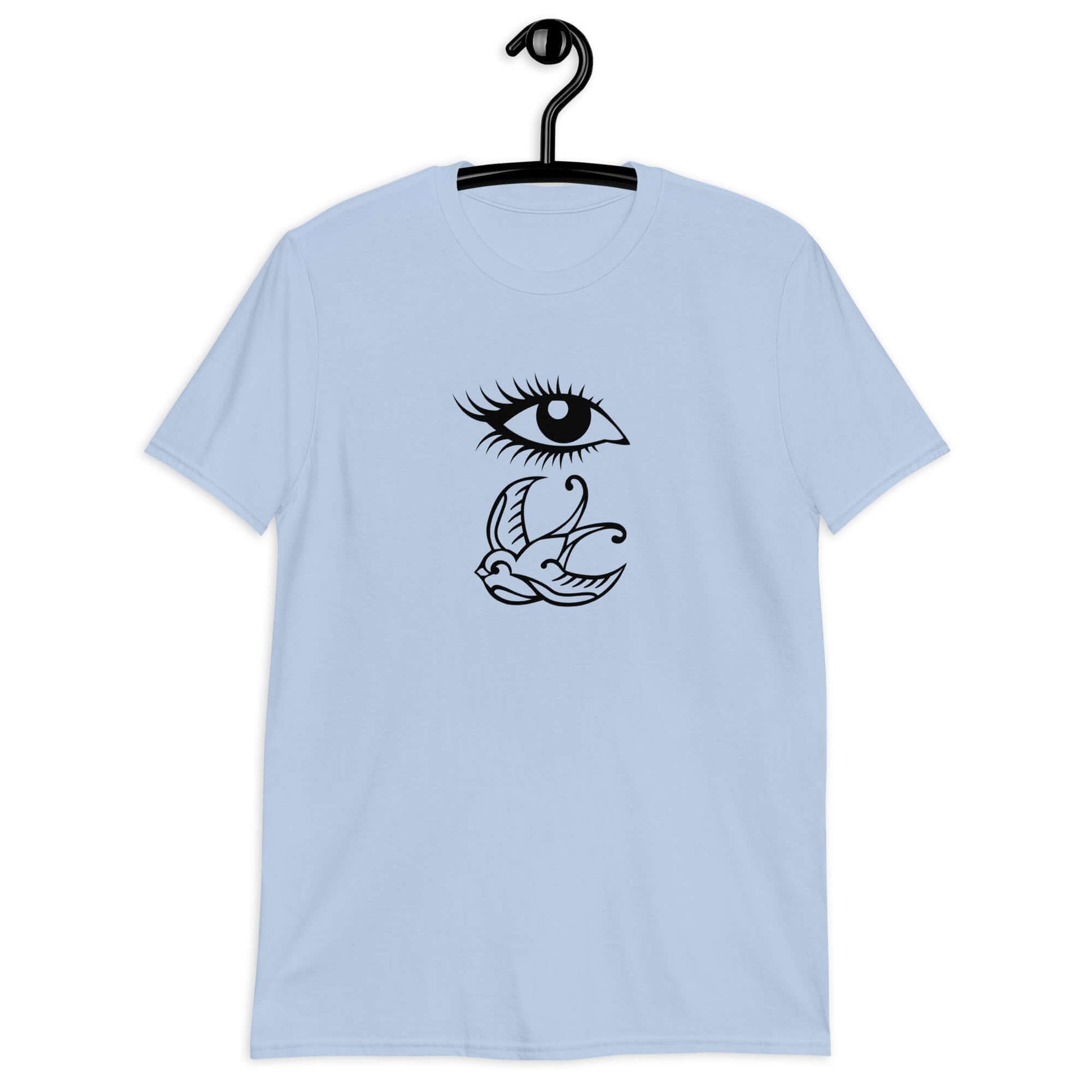 Light blue t-shirt with outline drawing of an eye and a swallow bird printed on the front.