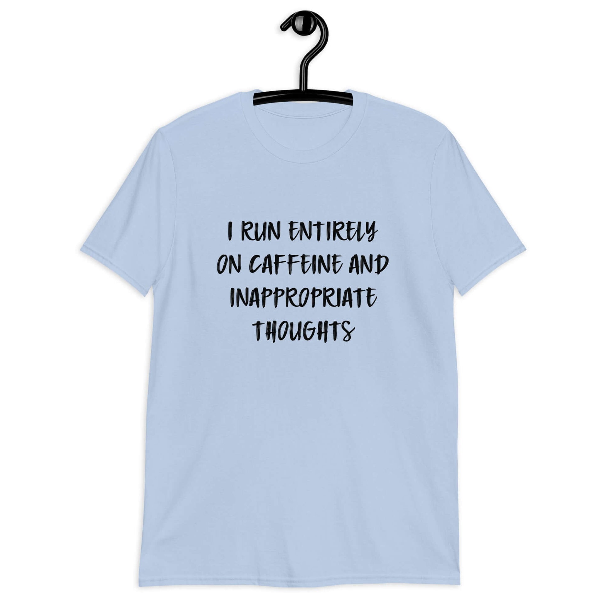 Light blue t-shirt with the phrase I run entirely on caffeine & inappropriate thoughts printed on the front.