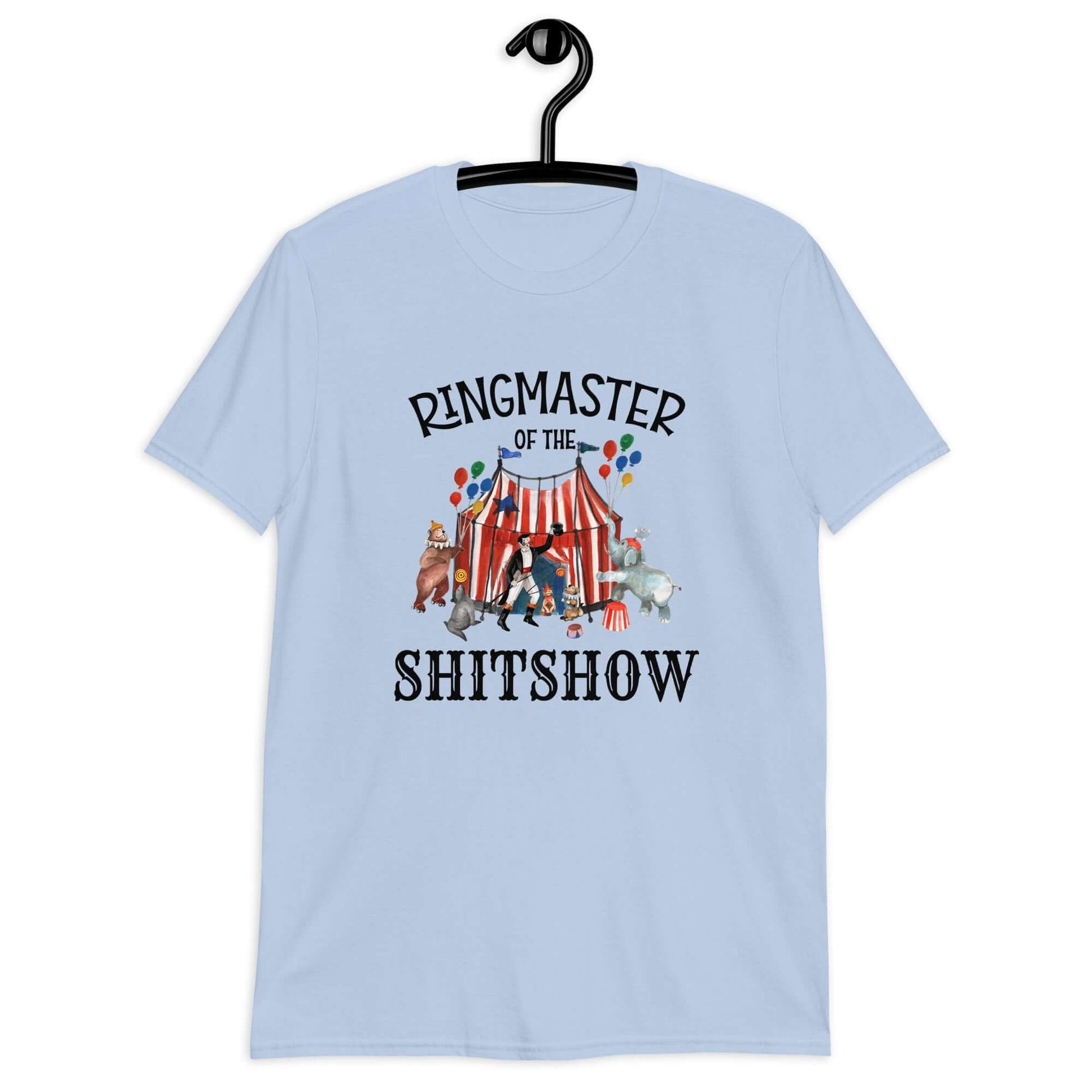 Light blue t-shirt with a circus theme graphic and the words Ringmaster of the Shitshow printed on the front.