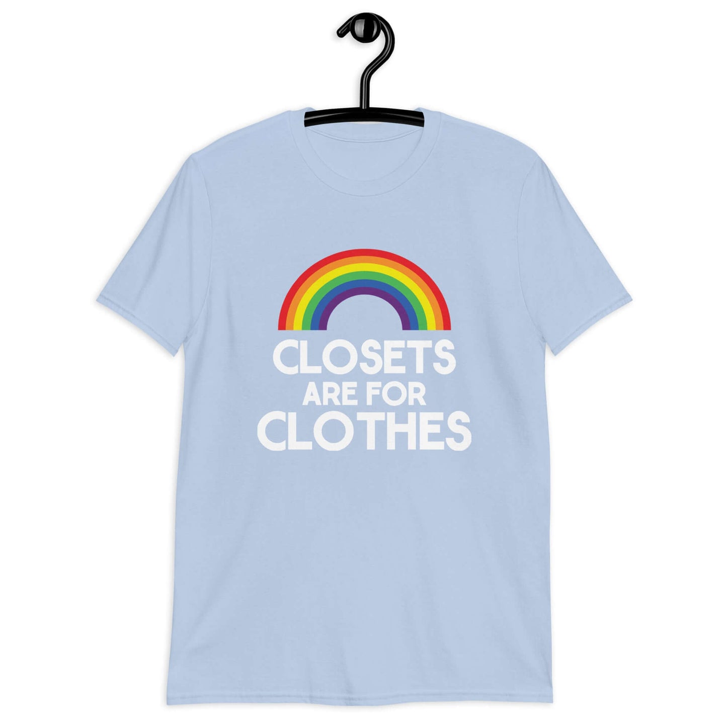 Light blue t-shirt with a rainbow and the words Clothes are for closets printed on the front.