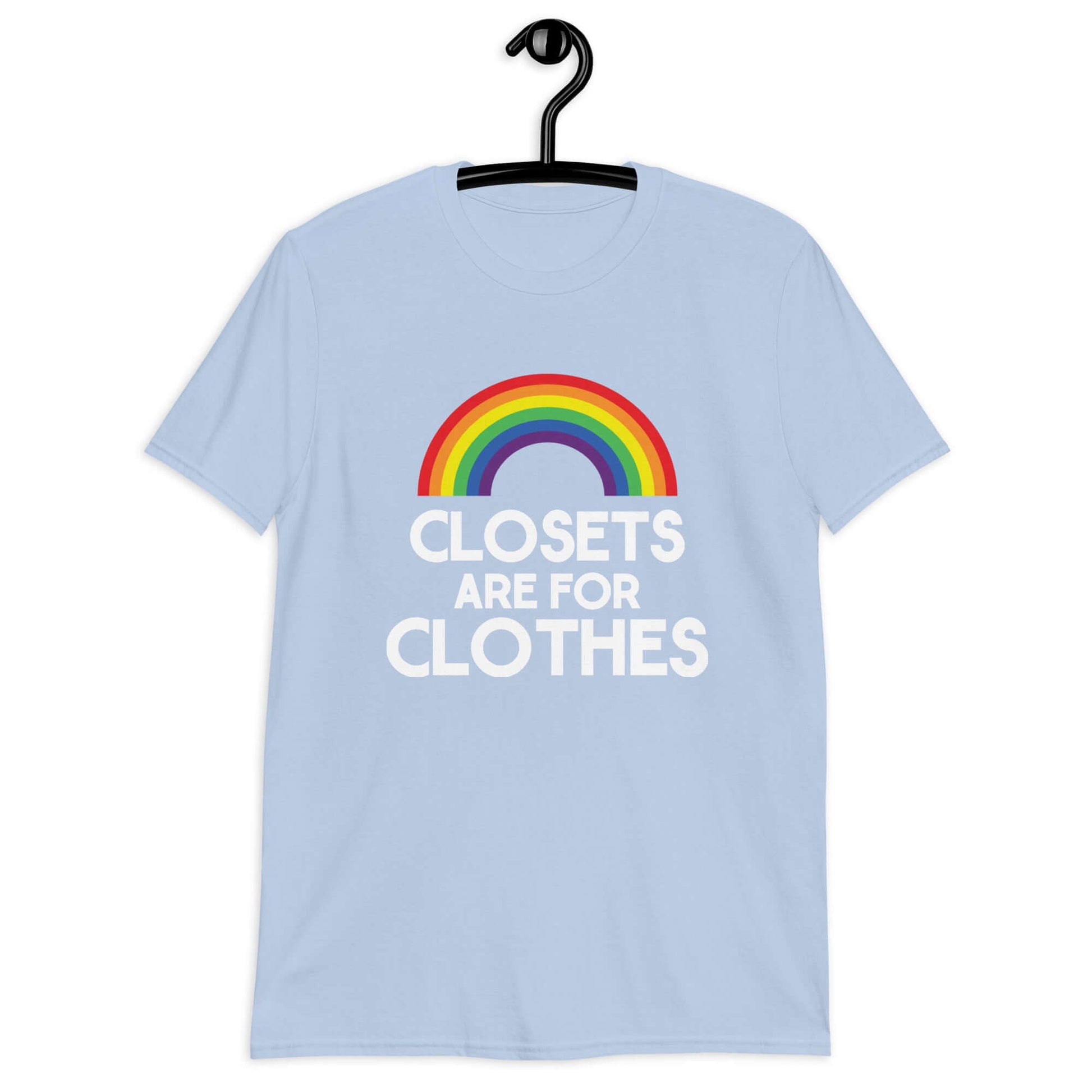 Light blue t-shirt with a rainbow and the words Clothes are for closets printed on the front.