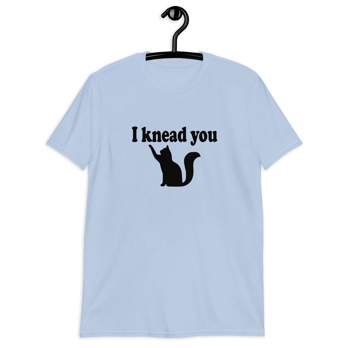 Light blue t-shirt that has an image of a silhouette of a cat and the words I knead you printed on the front.