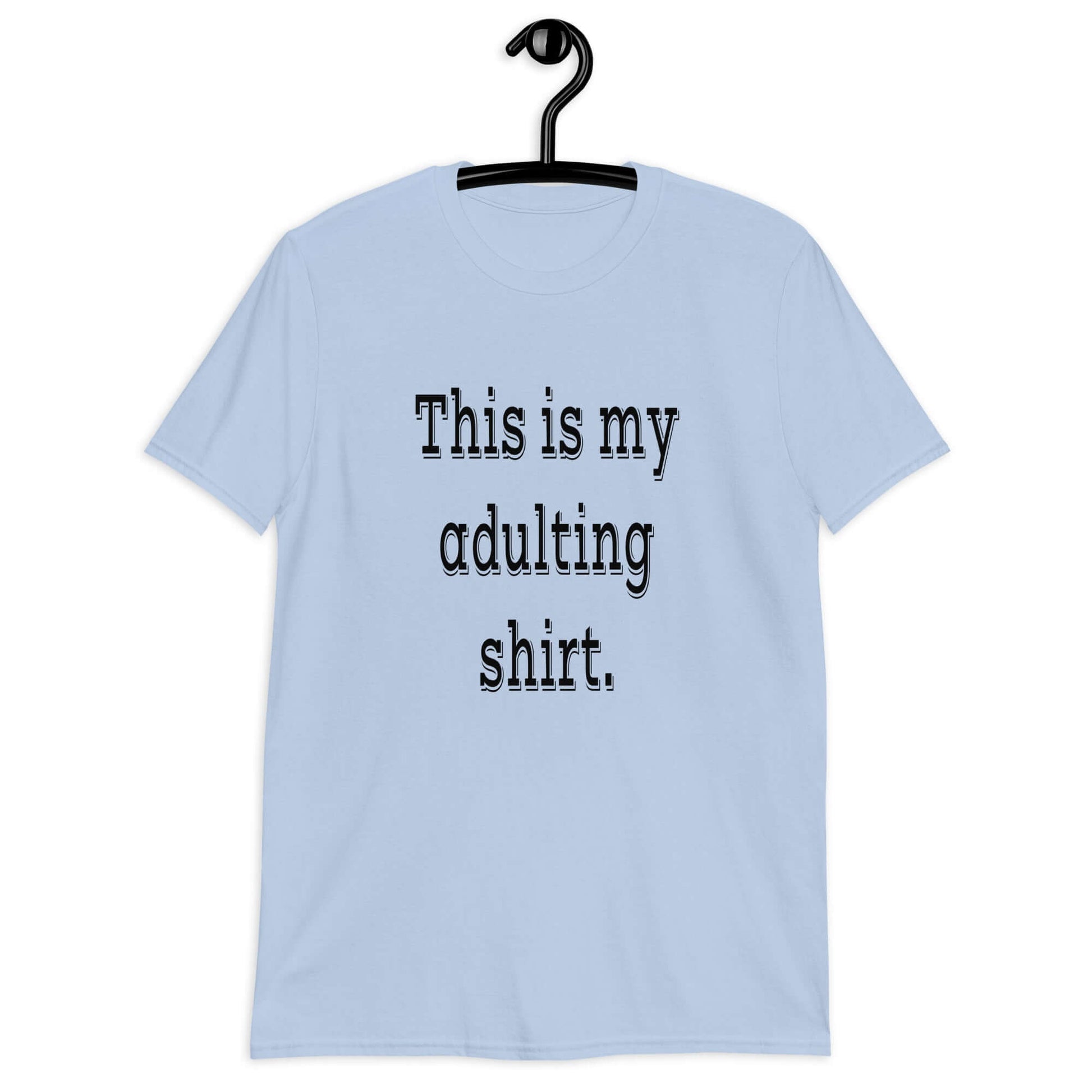 Light blue t-shirt with the phrase This is my adulting shirt printed on the front.