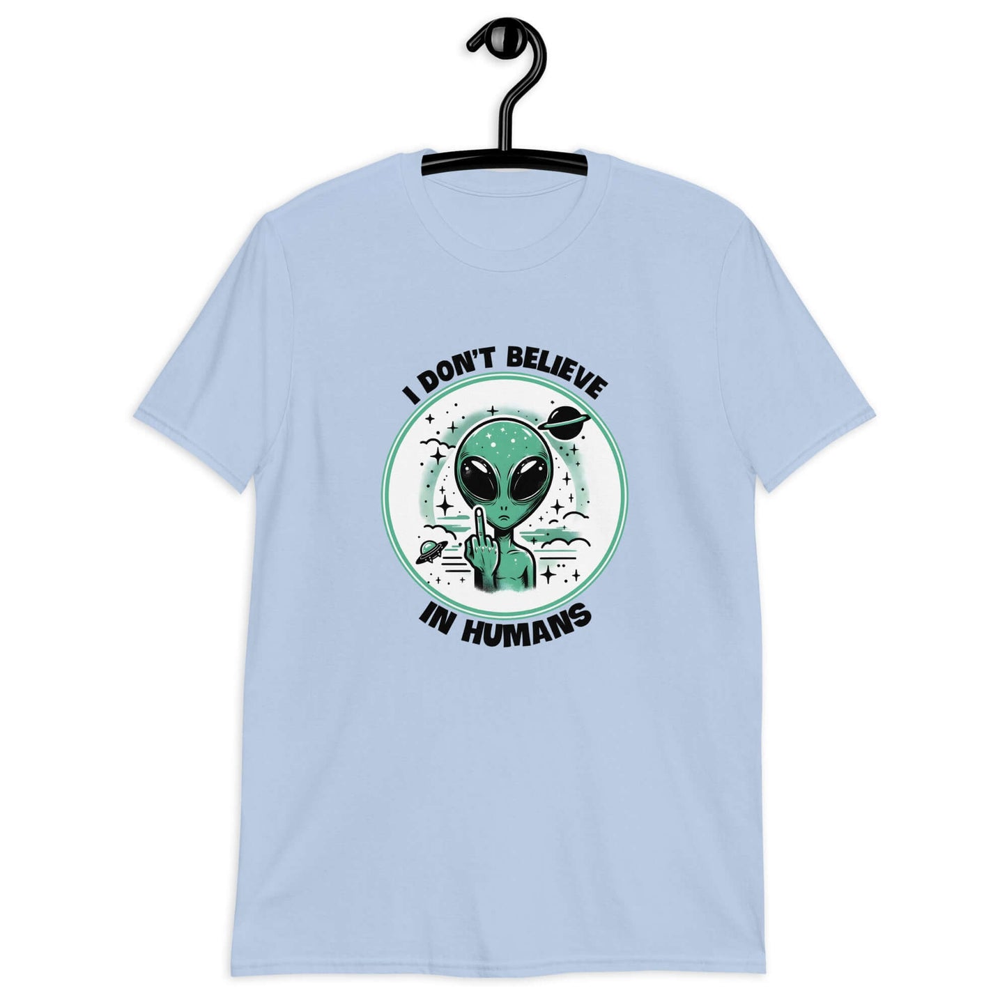 Light blue t-shirt with an image of an alien flipping the middle finger. The words I don't believe in humans are printed around the image. The graphics are printed on the front of the shirt.