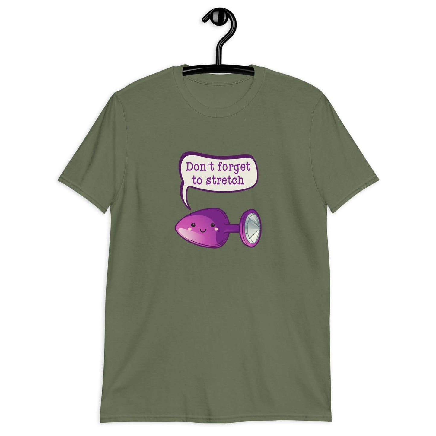 Military green t-shirt that has image of a purple anal plug with a smile face with a speech bubble above with the words Don't forget to stretch. The graphics are printed on the front of the shirt.