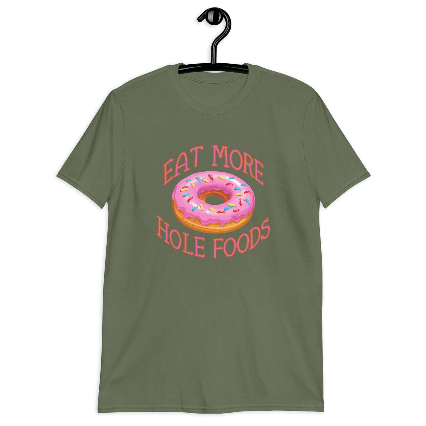 Military green t-shirt that has an image of a donut with pink icing and sprinkles and Eat more hole foods printed on the front.