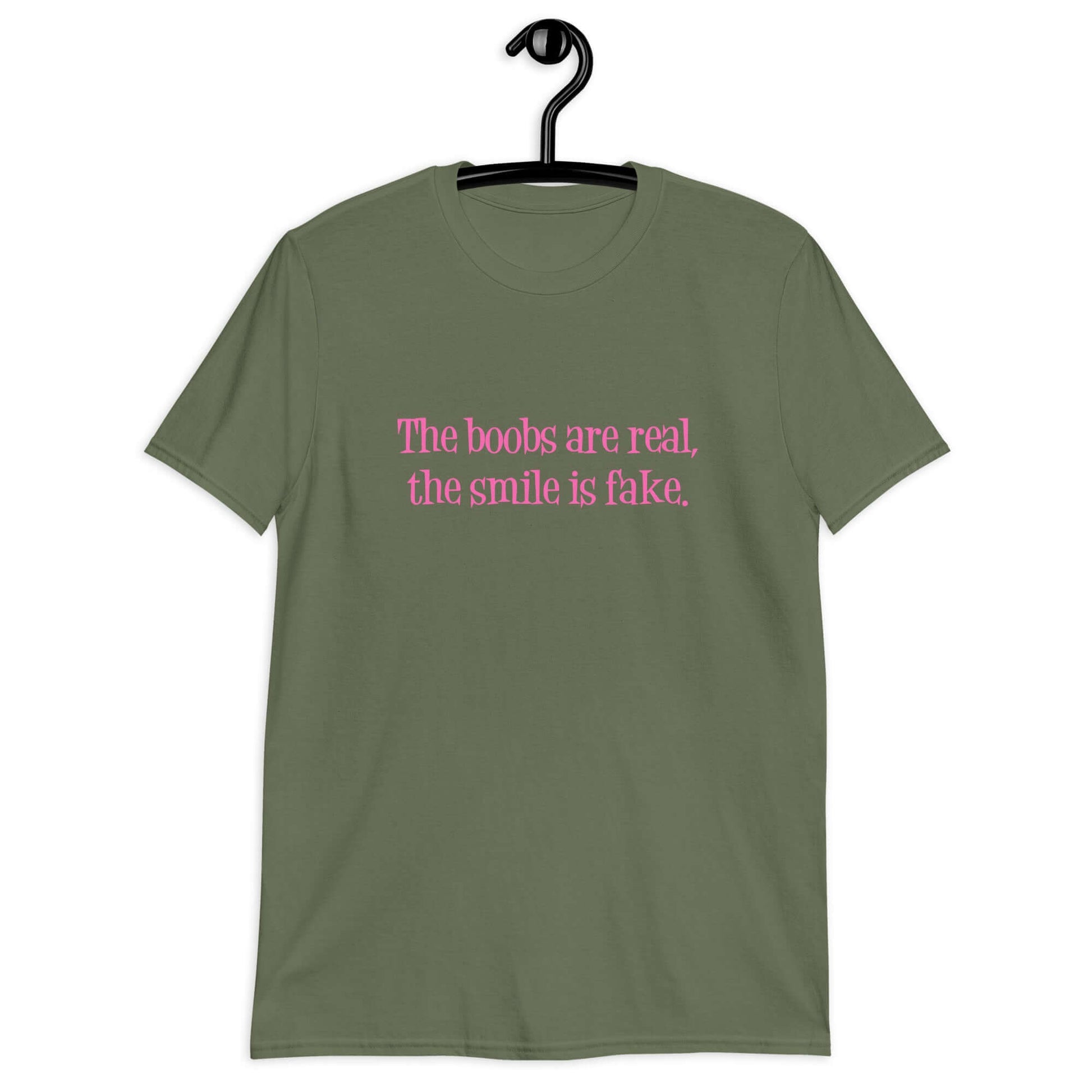 Military green t-shirt with the phrase The boobs are real, the smile is fake printed in pink on the front.