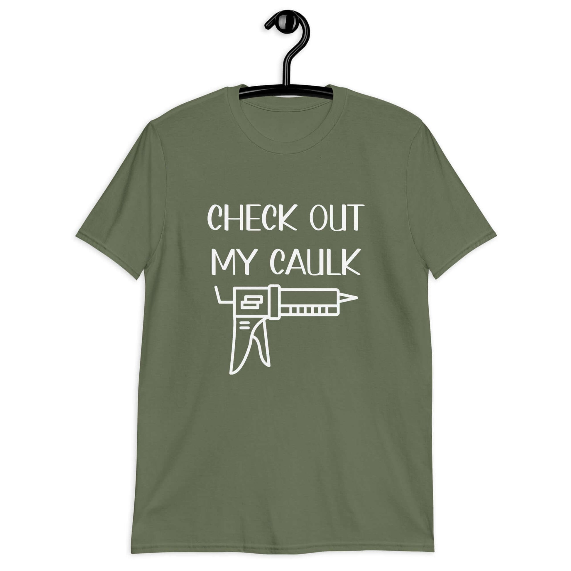 Military green t-shirt with the pun phrase Check out my caulk with a line drawing image of a caulking gun printed on the front.