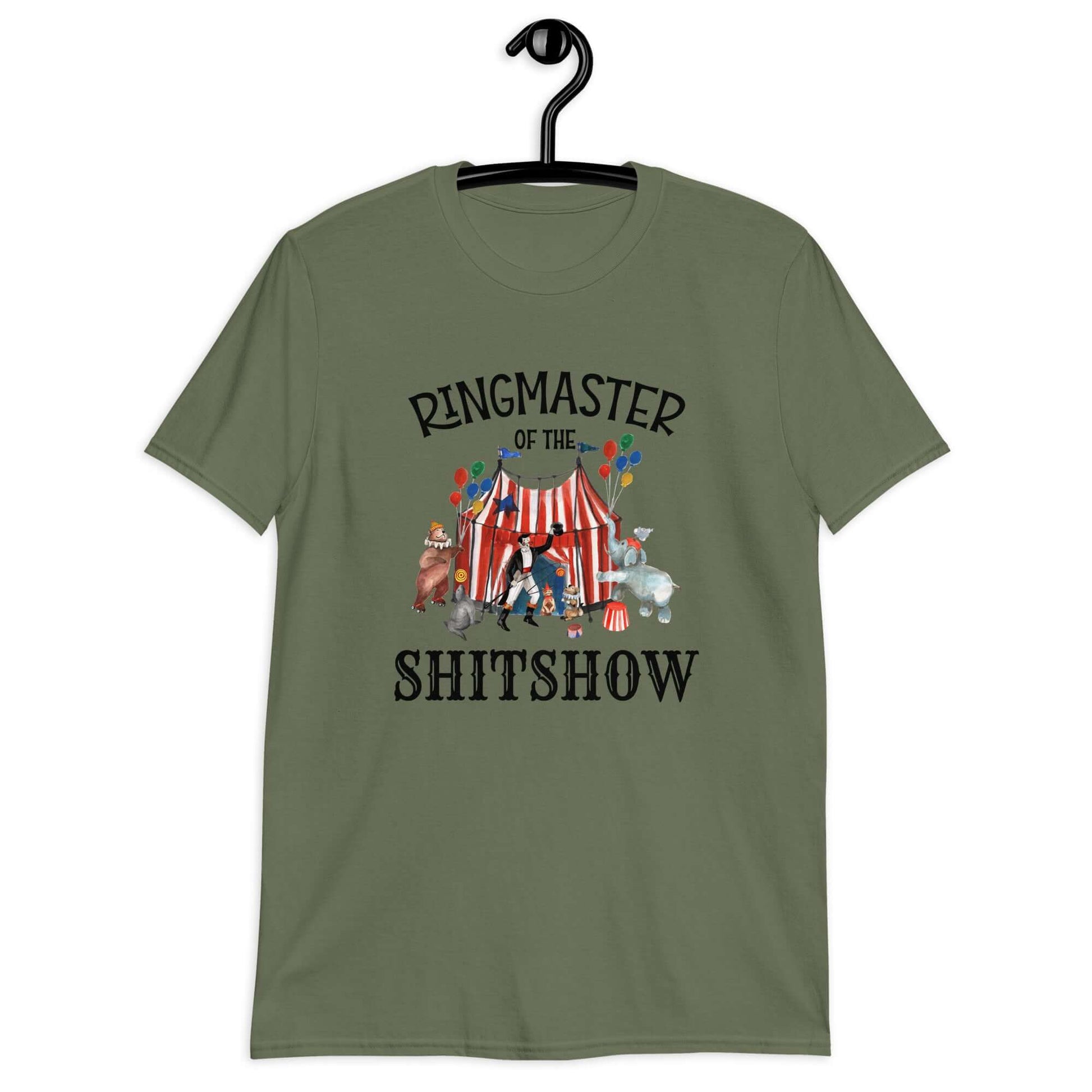 Military green t-shirt with a circus theme graphic and the words Ringmaster of the Shitshow printed on the front.