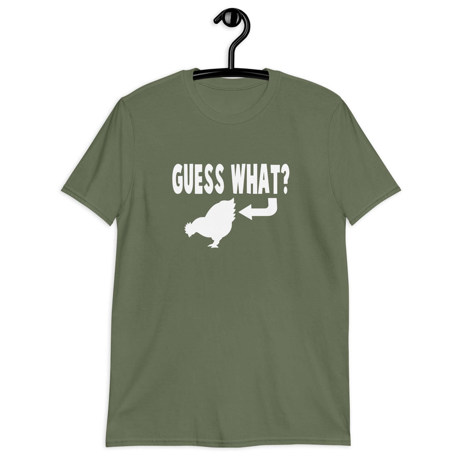 Military green t-shirt with an image of a chicken and the words Guess what question mark. There is an arrow pointing to the chickens butt. The graphics are printed on the front of the shirt.