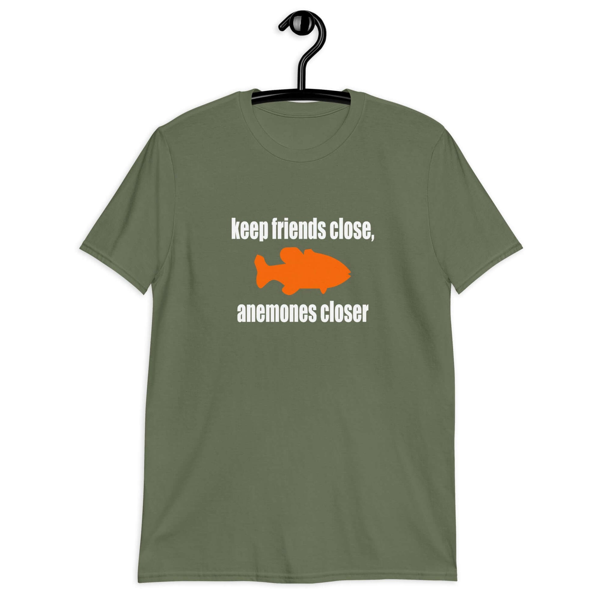 Military green t-shirt with the pun phrase Keep friends close, anemones closer with an image of an orange fish.