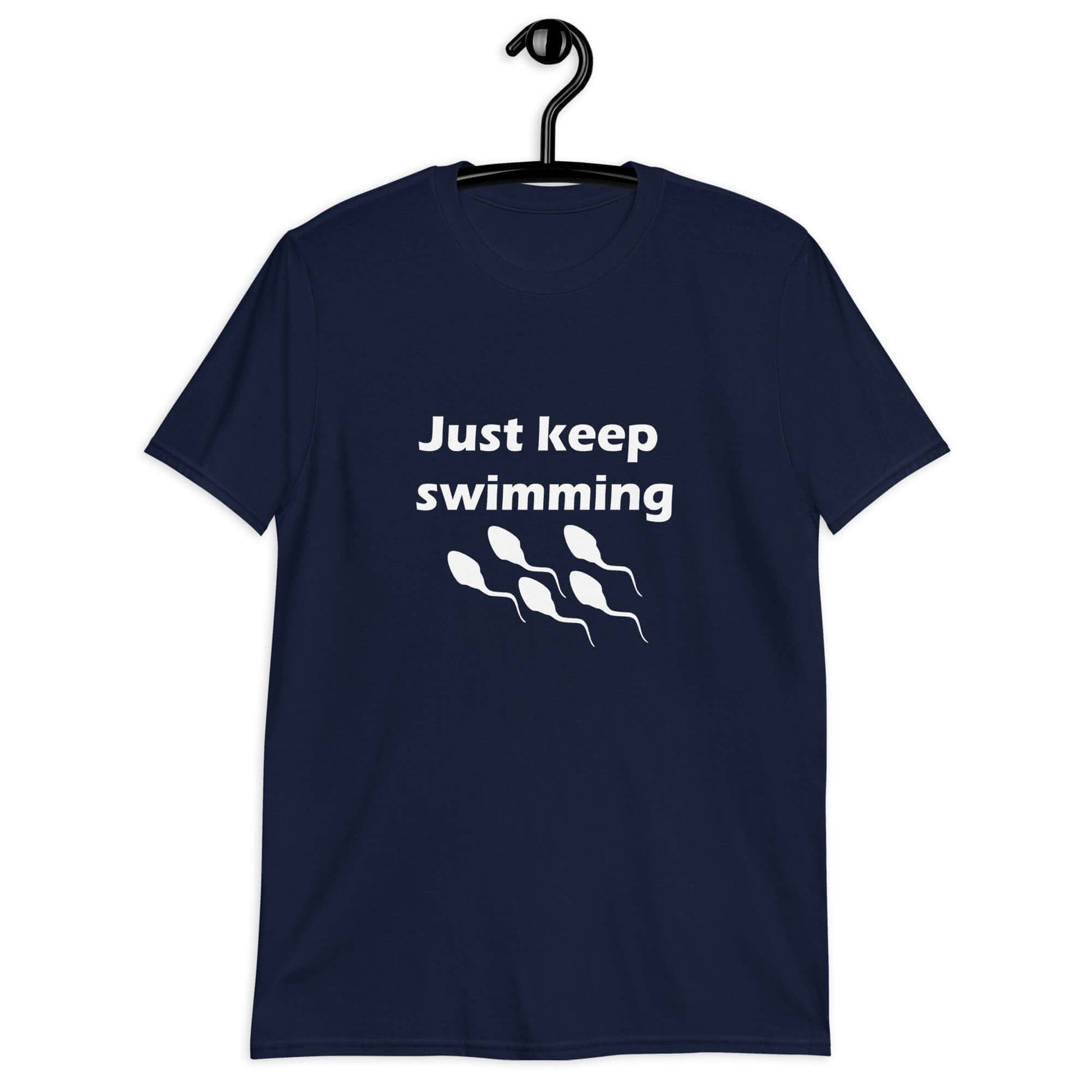 Navy blue t-shirt with the phrase Just keep swimming printed on the front. There is an image of some swimming sperm underneath the words.