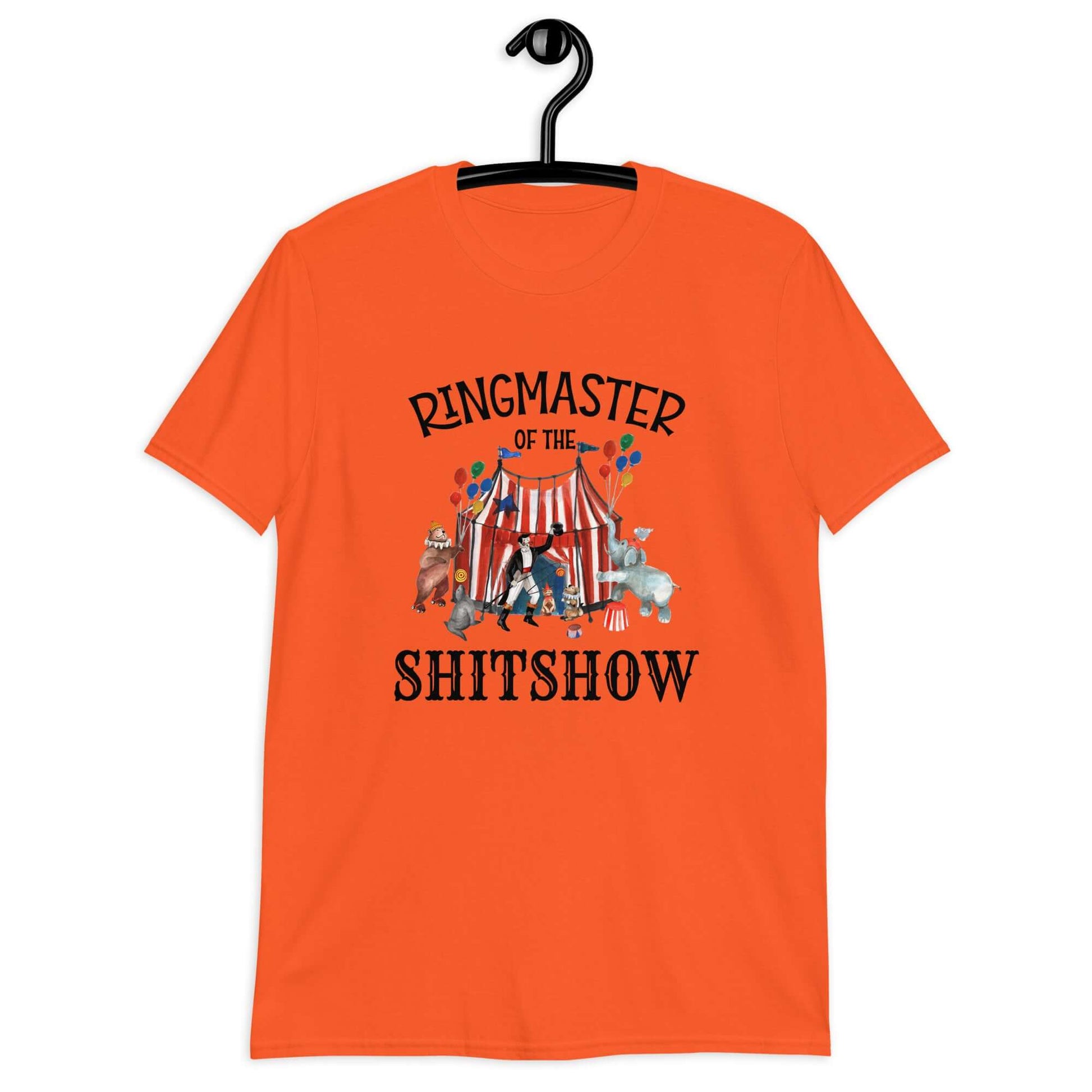 Orange t-shirt with a circus theme graphic and the words Ringmaster of the Shitshow printed on the front.
