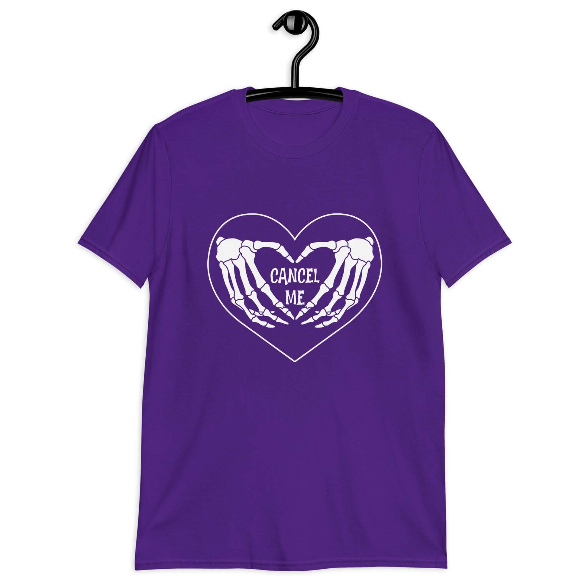 Purple t-shirt with a black heart and skeleton hands making a heart shape printed on the front. The words Cancel Me are inside of the heart.