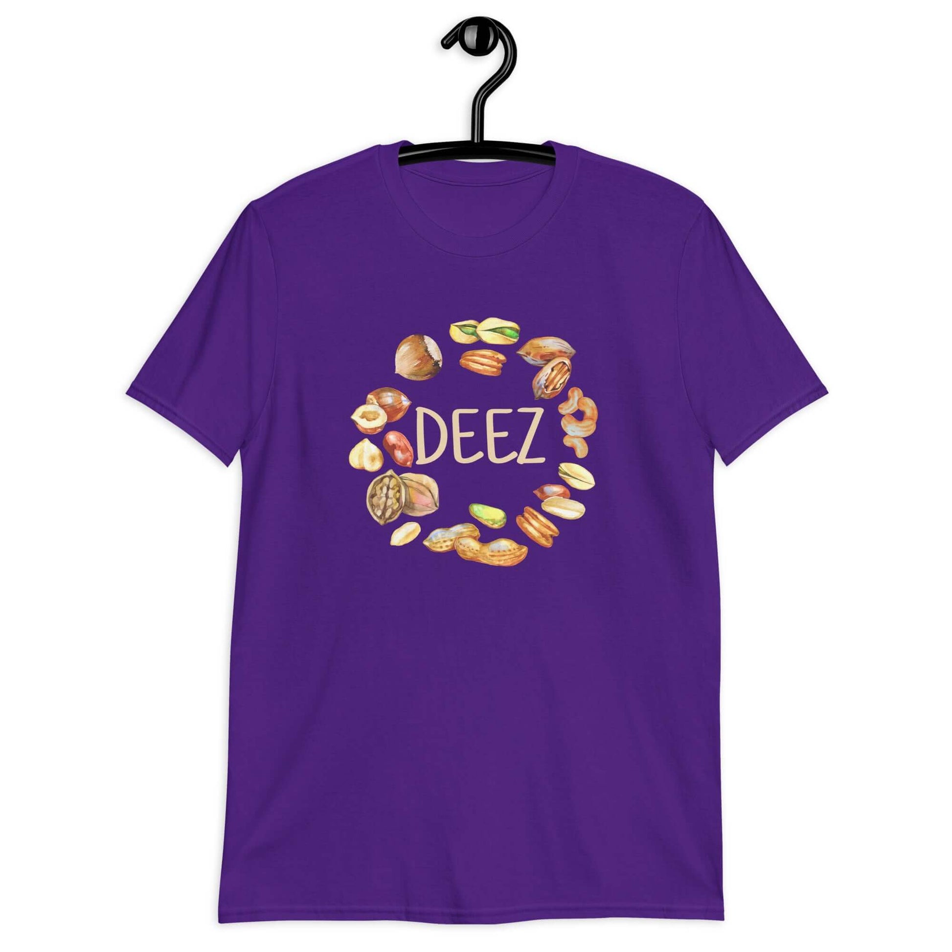 Purple t-shirt with an image of various nuts and the word Deez printed on the front.,