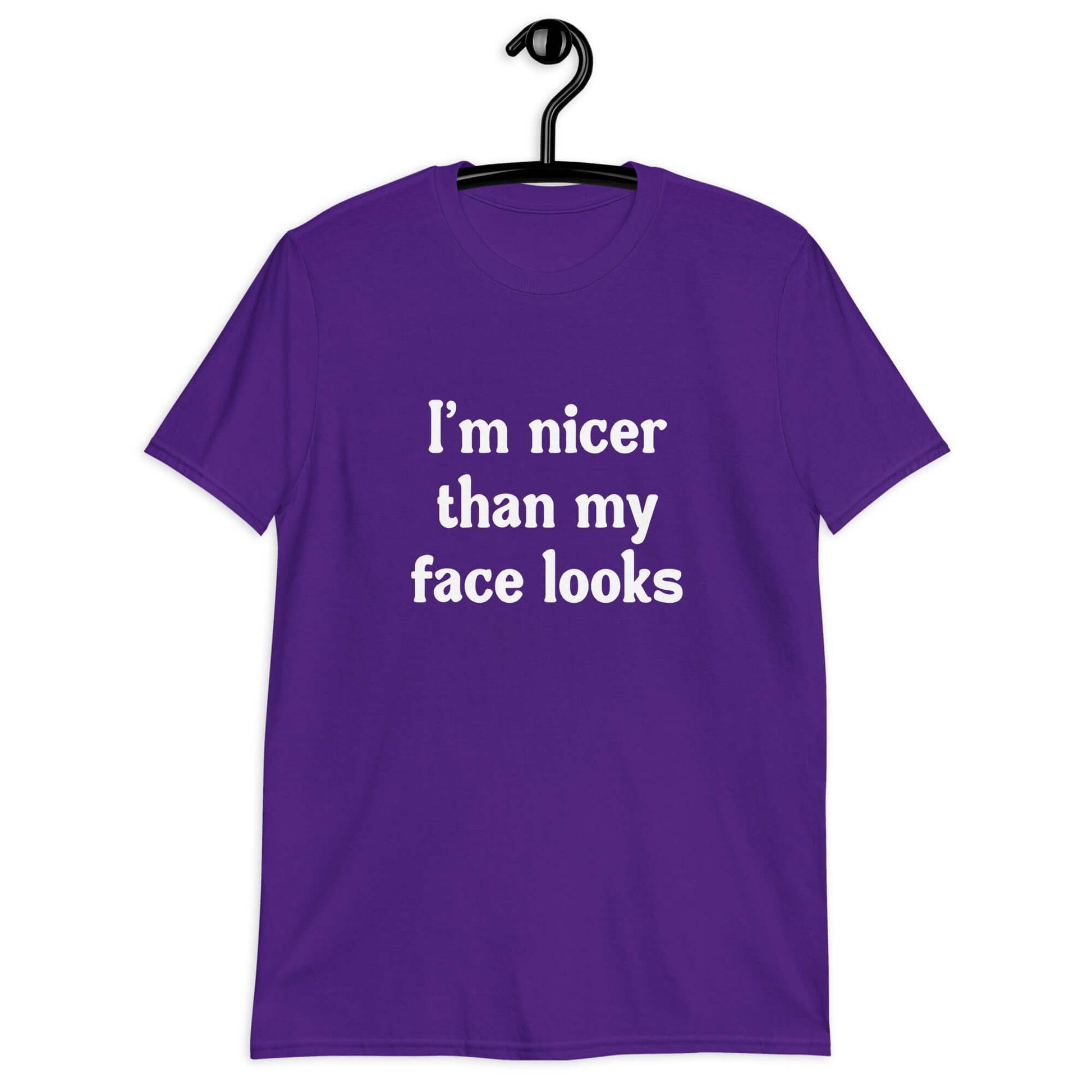 Purple t-shirt with the phrase I'm nicer than my face looks printed on the front.