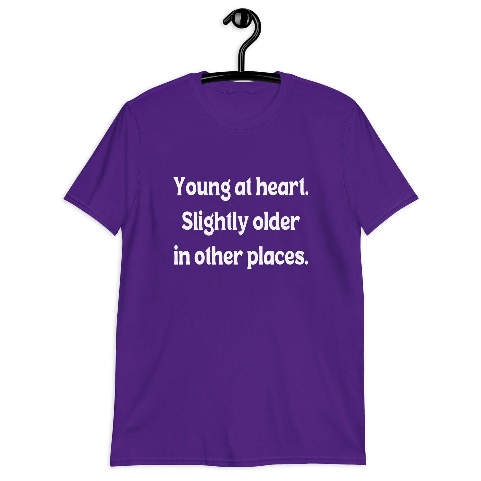 Purple t-shirt with the words Young at heart, slightly older in other places printed on the front.