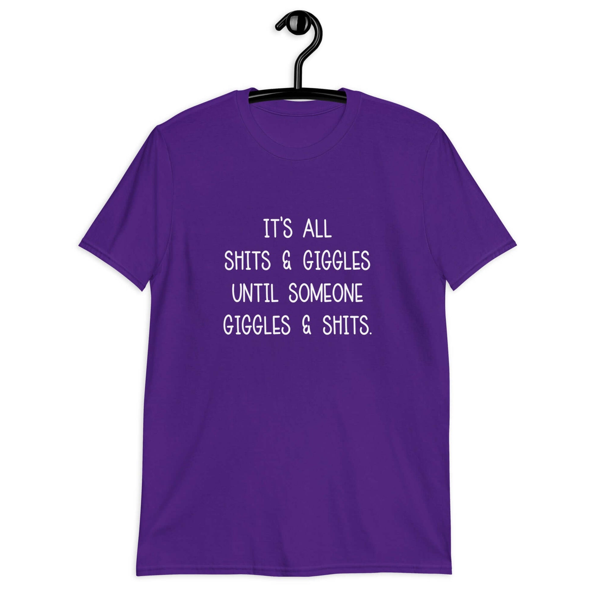 Purple t-shirt with the phrase It's all shits & giggles until someone giggles & shits printed on the front.