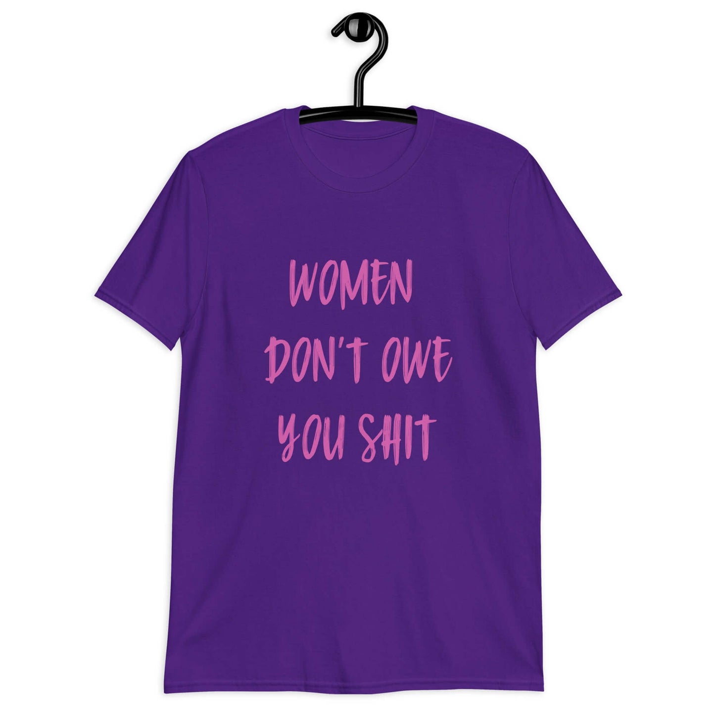 Purple t-shirt with the words Women don't owe you shit printed on the front in pink.