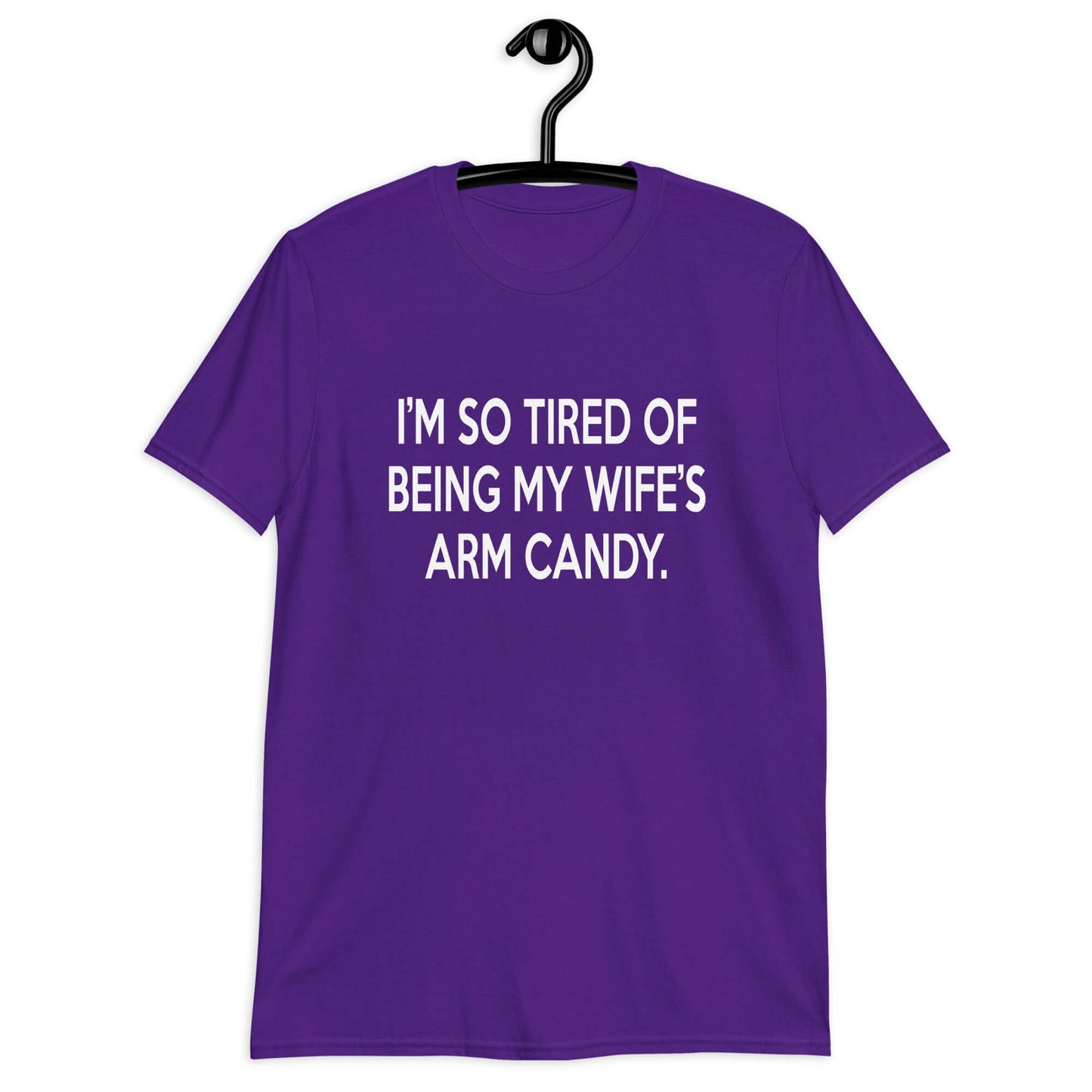 Purple t-shirt with the funny phrase I'm so tired of being my wife's arm candy printed on the front.