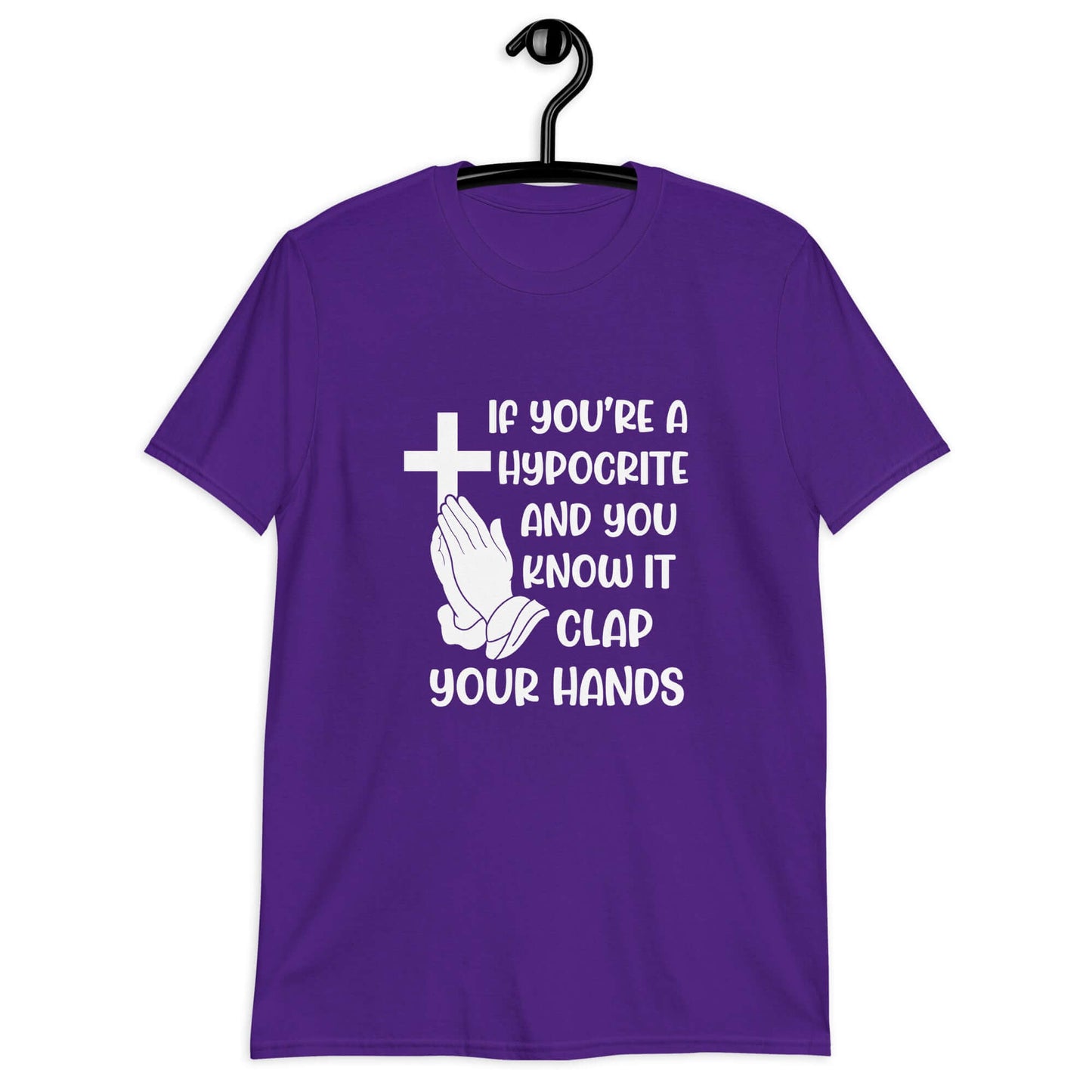 Purple t-shirt with image of a cross and praying hands & the phrase If you're a hypocrite and you know it clap your hands printed on the front.