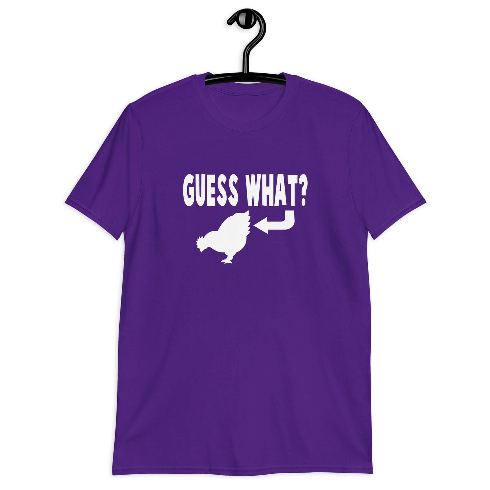 Purple t-shirt with an image of a chicken and the words Guess what question mark. There is an arrow pointing to the chickens butt. The graphics are printed on the front of the shirt.