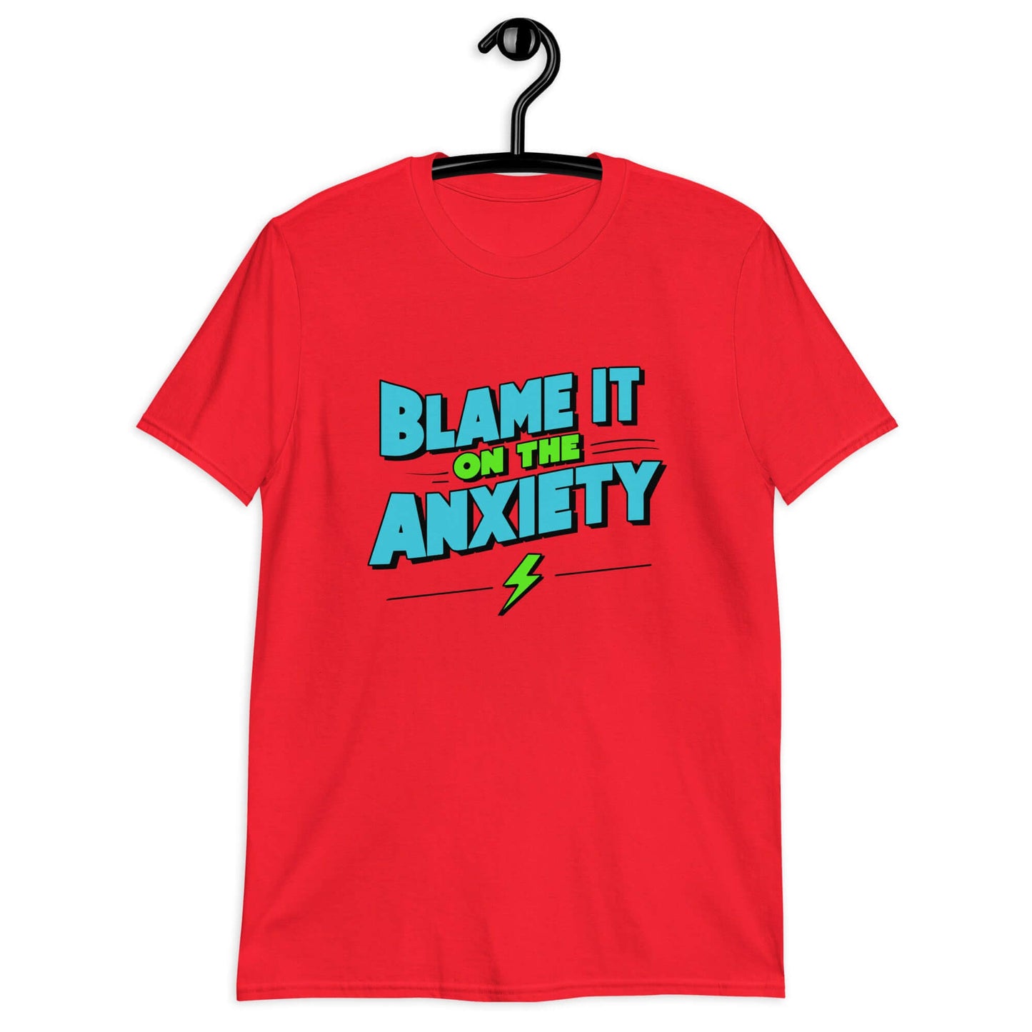 Red t-shirt with the phrase Blame is on the anxiety printed on the front. The graphics are bold and in aqua and lime green.