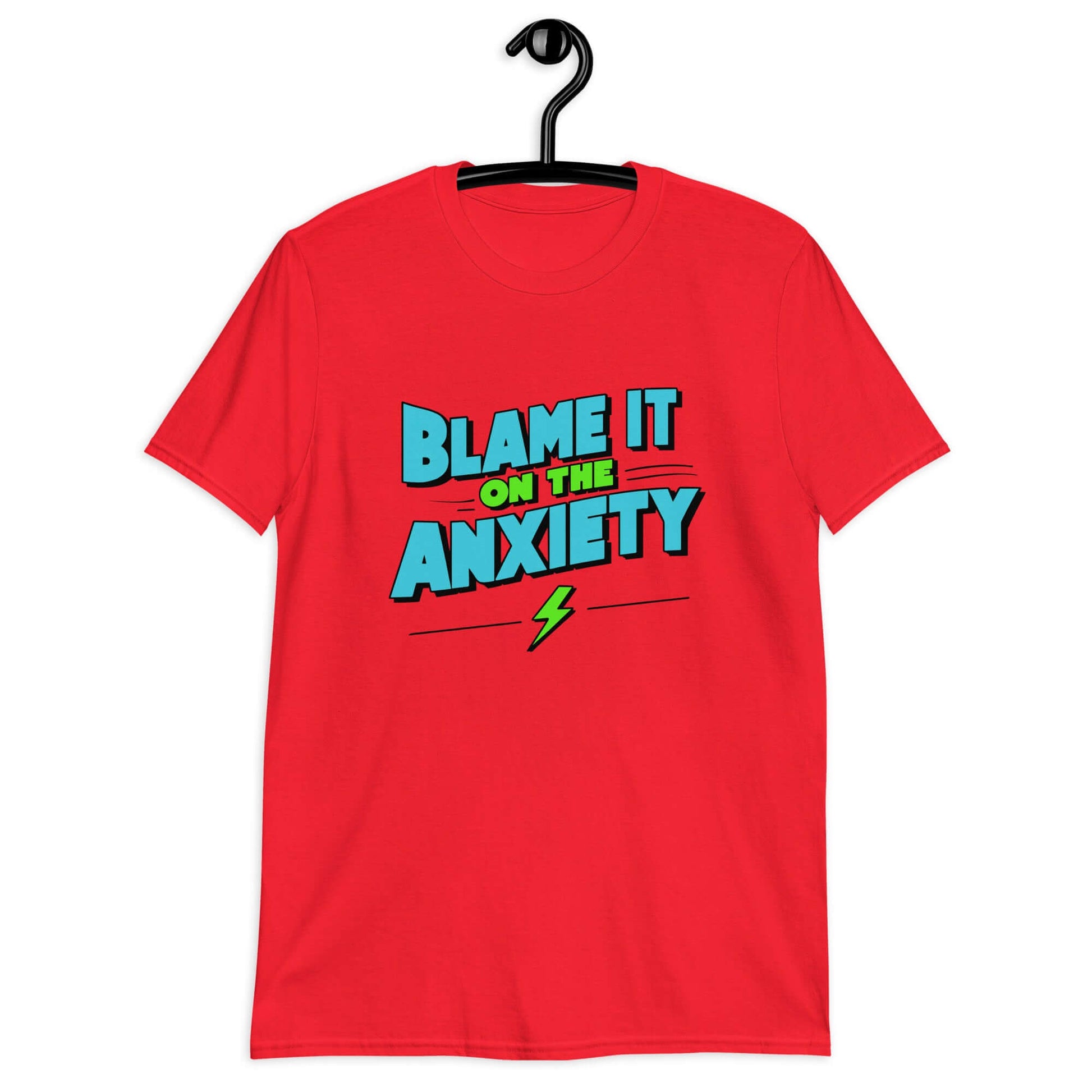 Red t-shirt with the phrase Blame is on the anxiety printed on the front. The graphics are bold and in aqua and lime green.