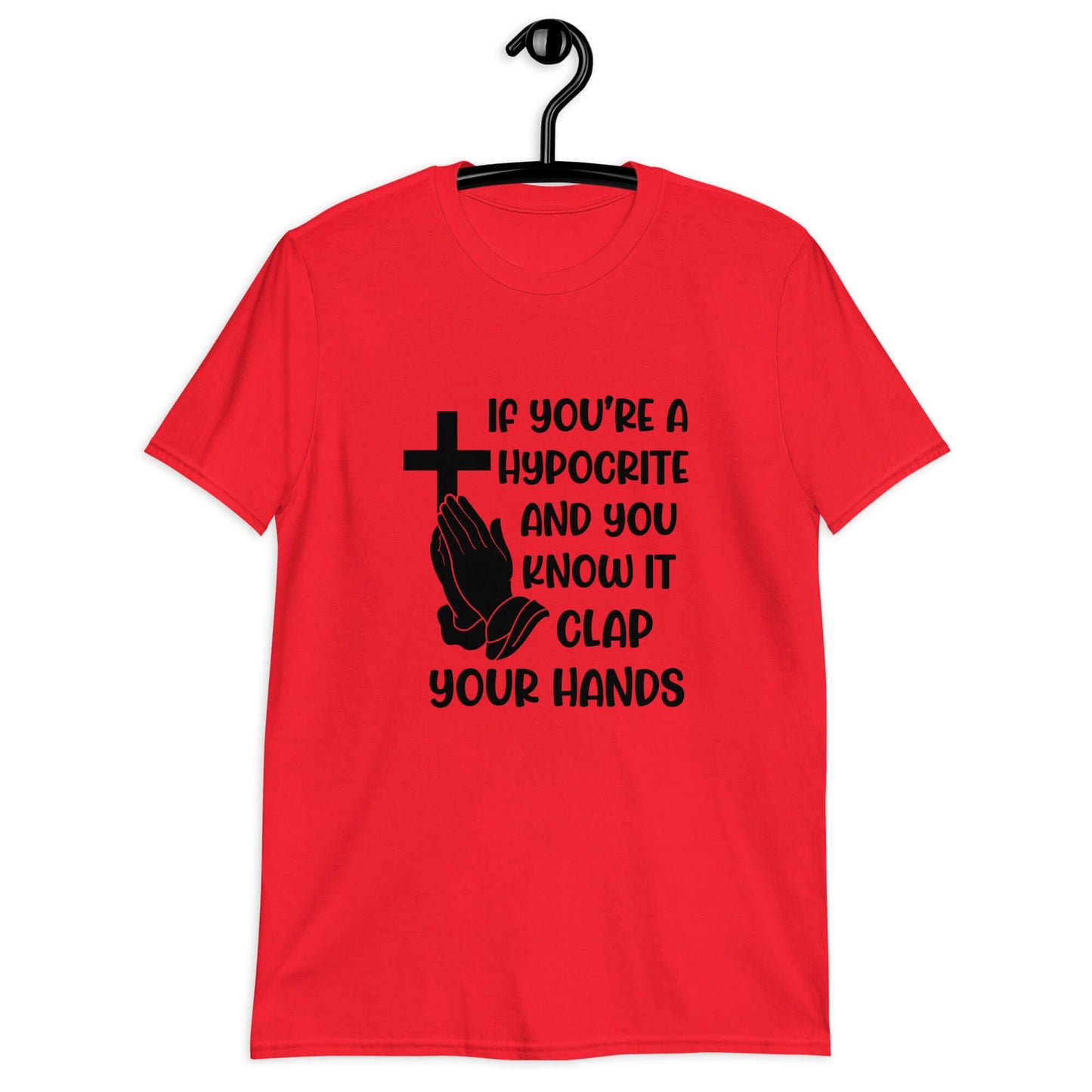 Red t-shirt with image of a cross and praying hands & the phrase If you're a hypocrite and you know it clap your hands printed on the front.