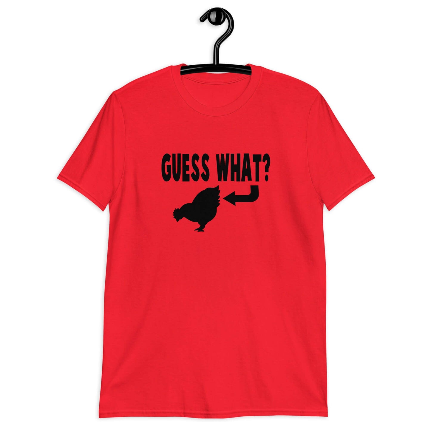 Red t-shirt with an image of a chicken and the words Guess what question mark. There is an arrow pointing to the chickens butt. The graphics are printed on the front of the shirt.