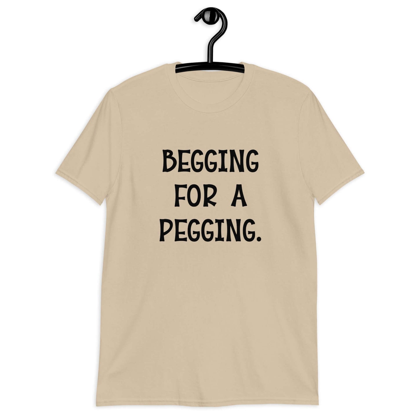 Sand t-shirt with the words Begging for a pegging printed on the front.