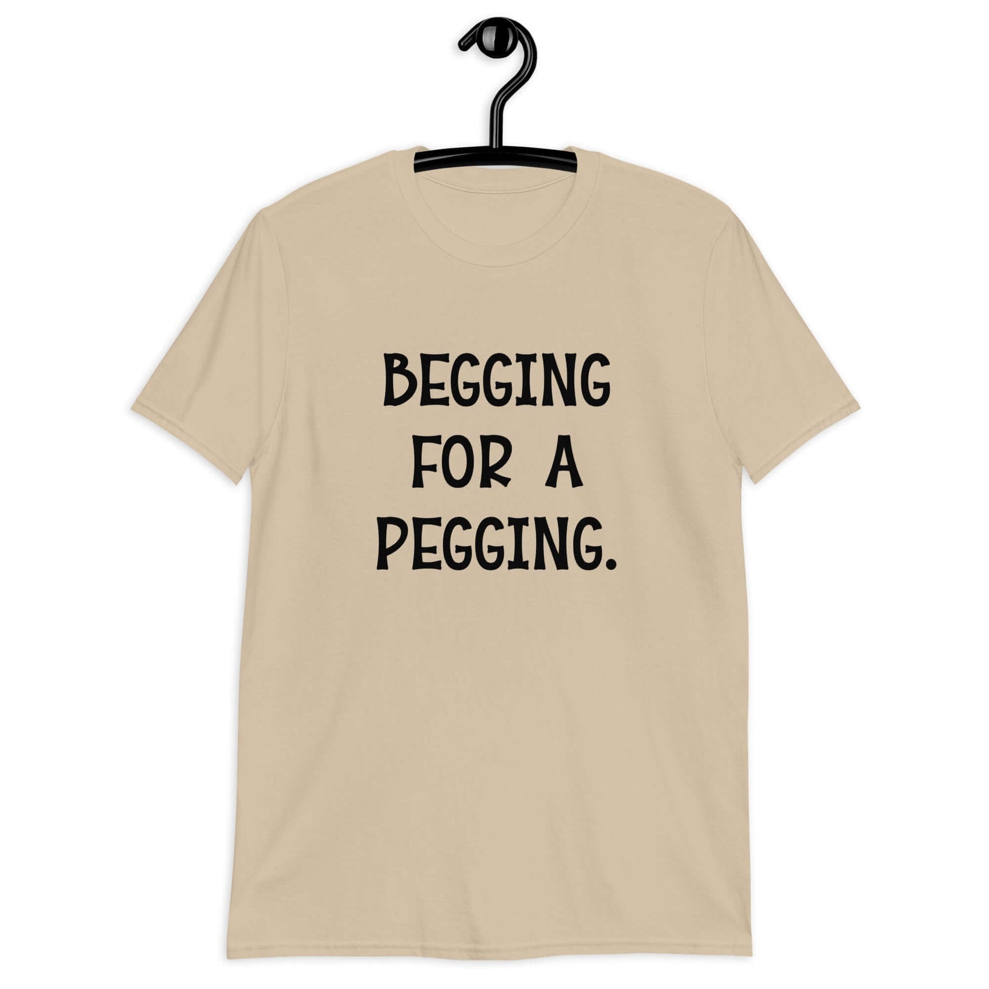 Sand t-shirt with the words Begging for a pegging printed on the front.