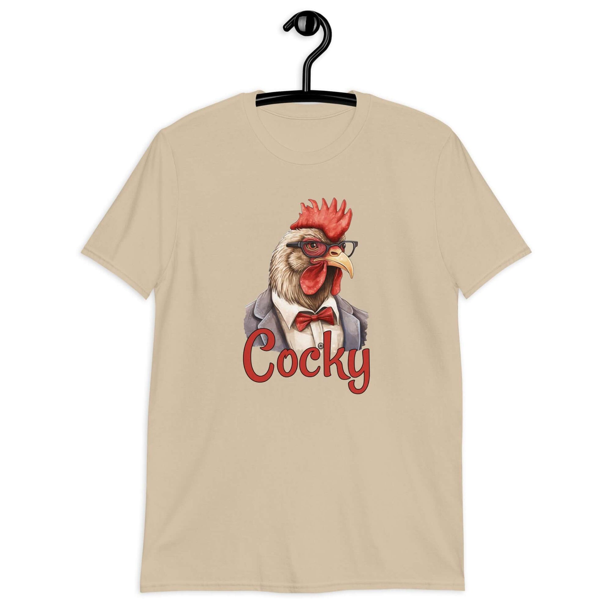 Sand t-shirt with image of a rooster and the word Cocky printed on the front.