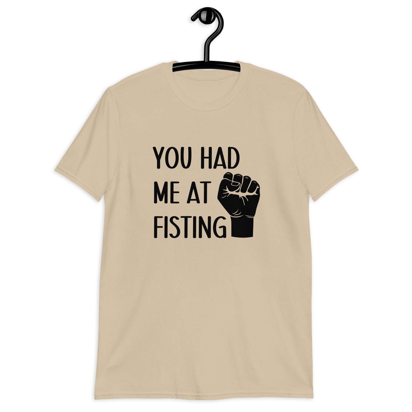 Sand t-shirt with image of a fist and the words You had me at fisting printed on the front.